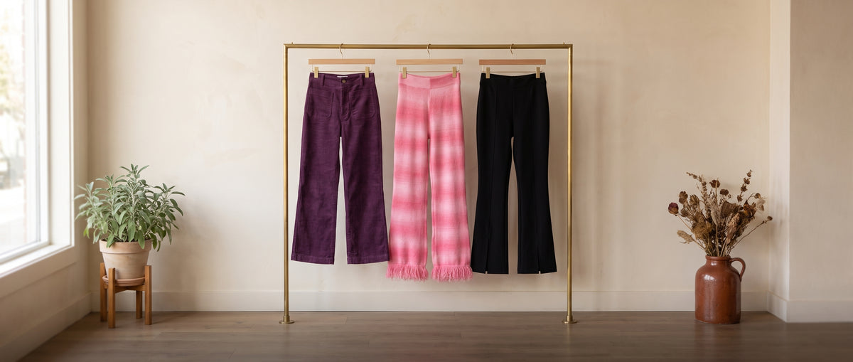 Trousers together: purple corduroy wide-leg pants, pink ombre lounge pants and black wide-leg pants
