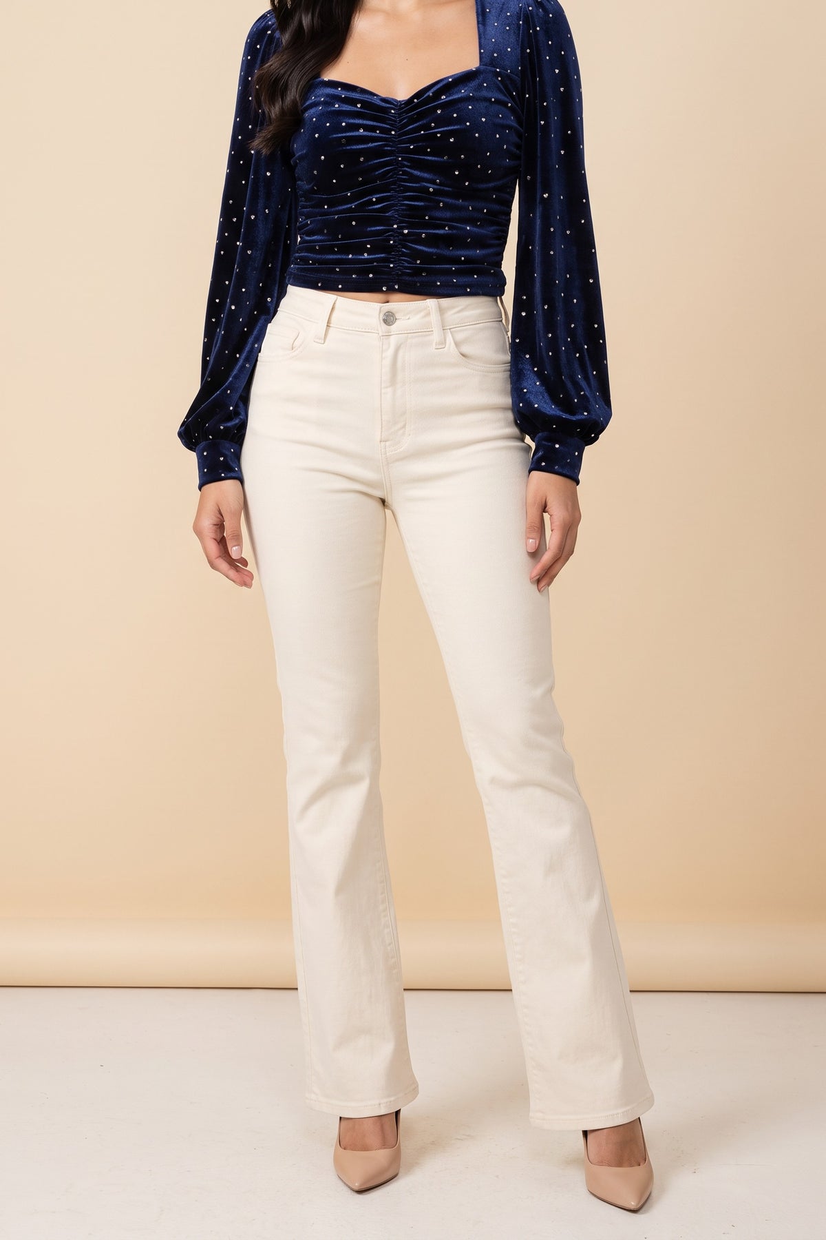 Front view of the Heart of Glass navy velvet sweetheart top worn by our model.