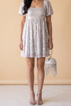 Front view of the Lola pearl rhinestone fringe ball bag.
