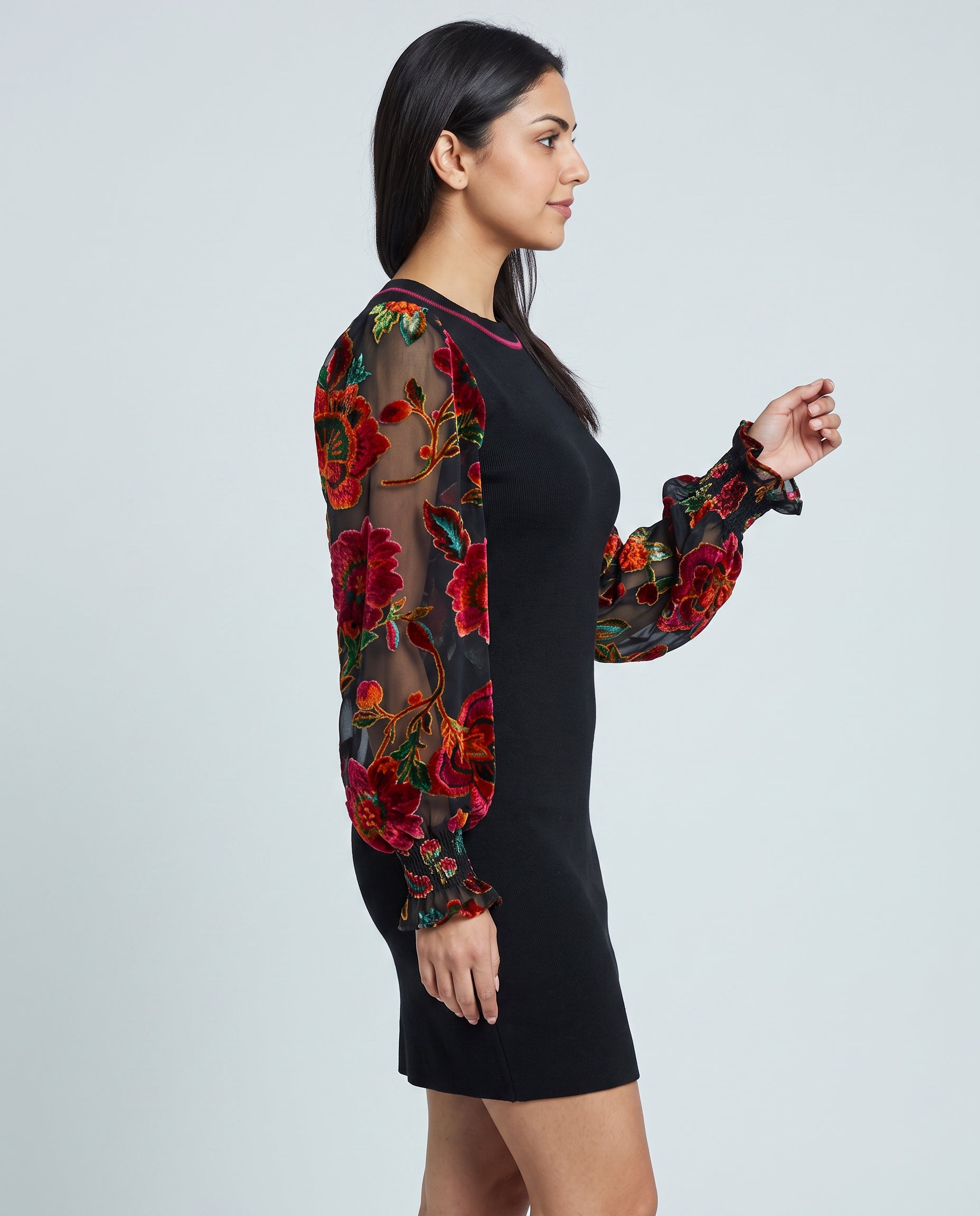 Side view of You're My Favorite Sweater Dress showing its close fit, sleeve volume and mini length.