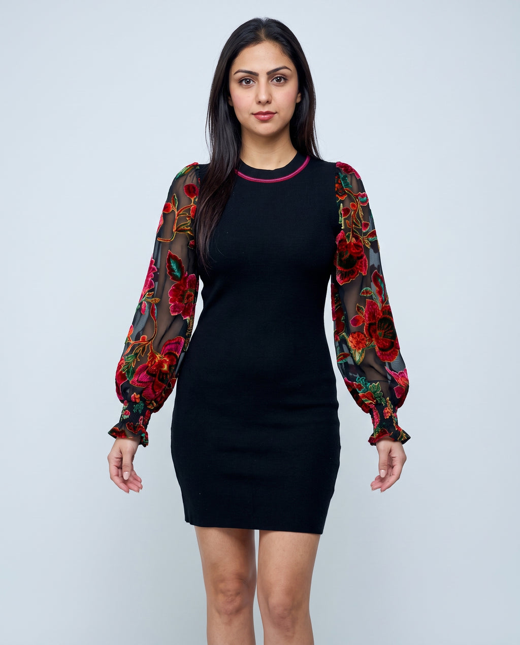 Front view of You're My Favorite Sweater Dress showing its fitted mini shape and floral sheer sleeves.