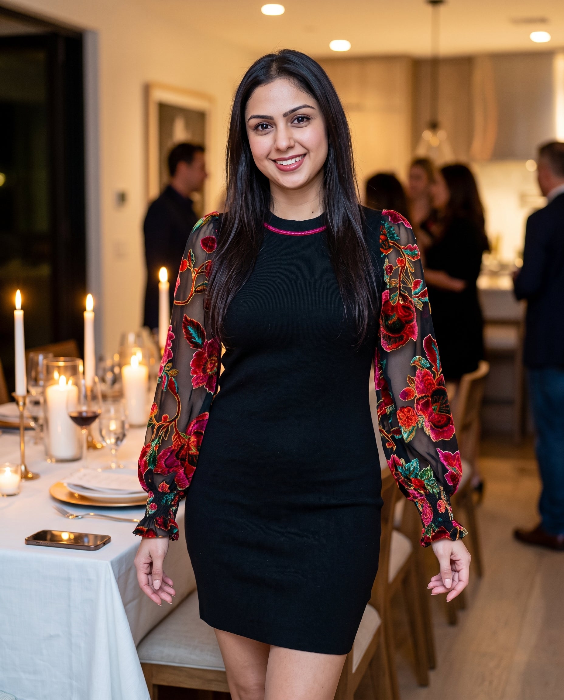 Shweta wearing You're My Favorite Sweater Dress at an evening dinner party.