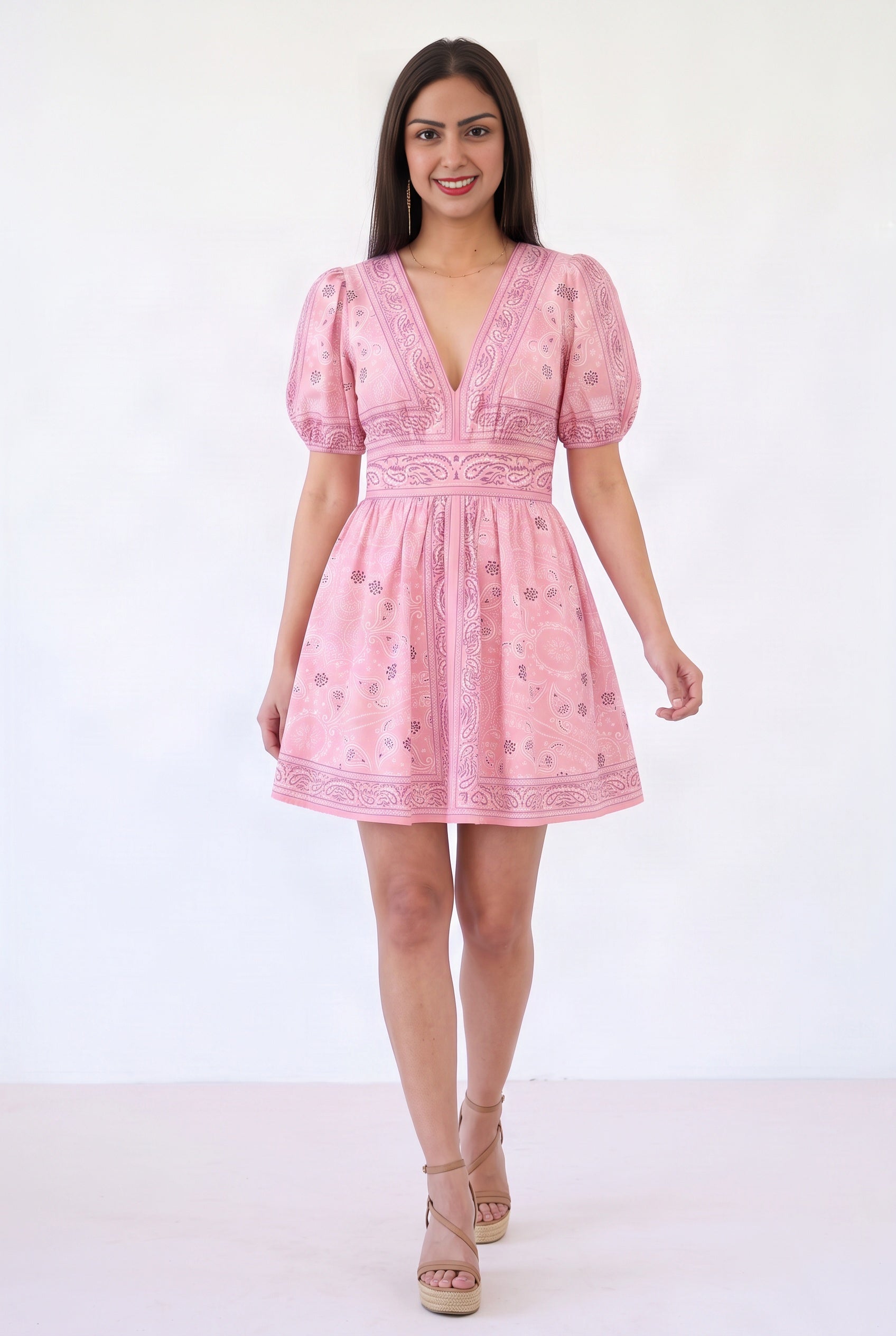 Shweta walking in the Forget Me Not Paisley Dress, showing the gathered mini skirt in motion.