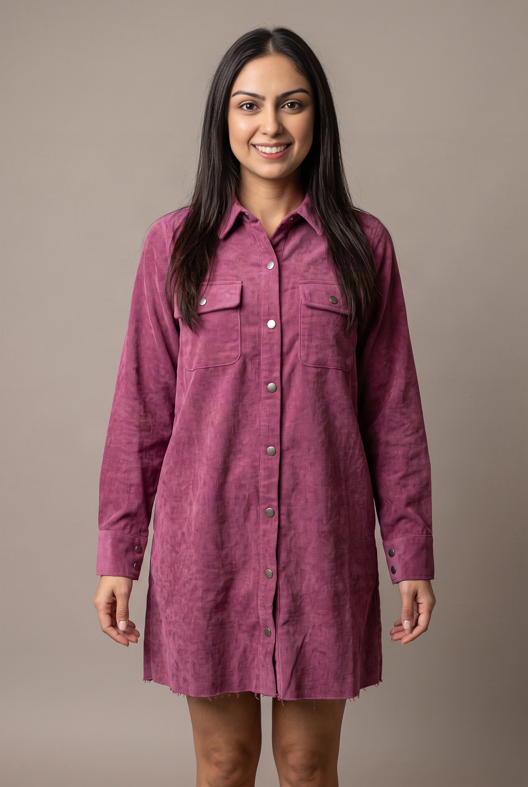 Part Of My Story corduroy shirt dress front view showing its relaxed mini fit and raw hem.