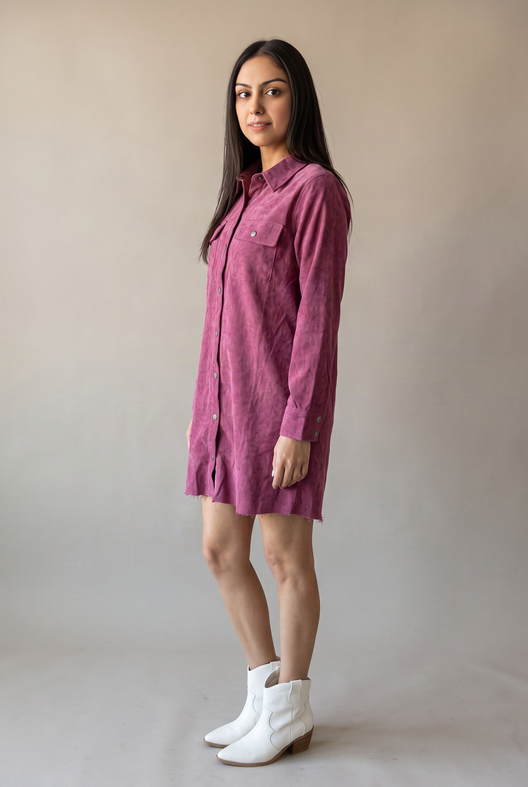 Side view of the Part Of My Story corduroy shirt dress showing body depth and mini length.