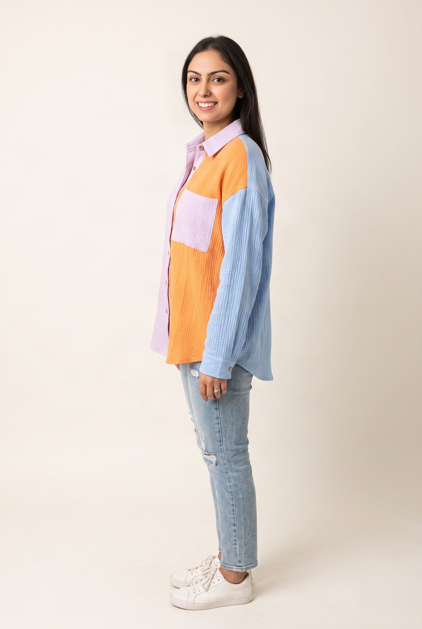 Side view of the Orange-Blue Just Chilling shirt showing its loose fit and curved hem.