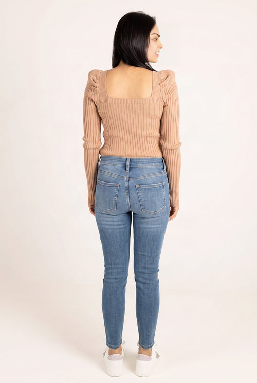 Rear view of Bold Adventures skinny jeans showing the exposed yoke, waistband and patch pockets.