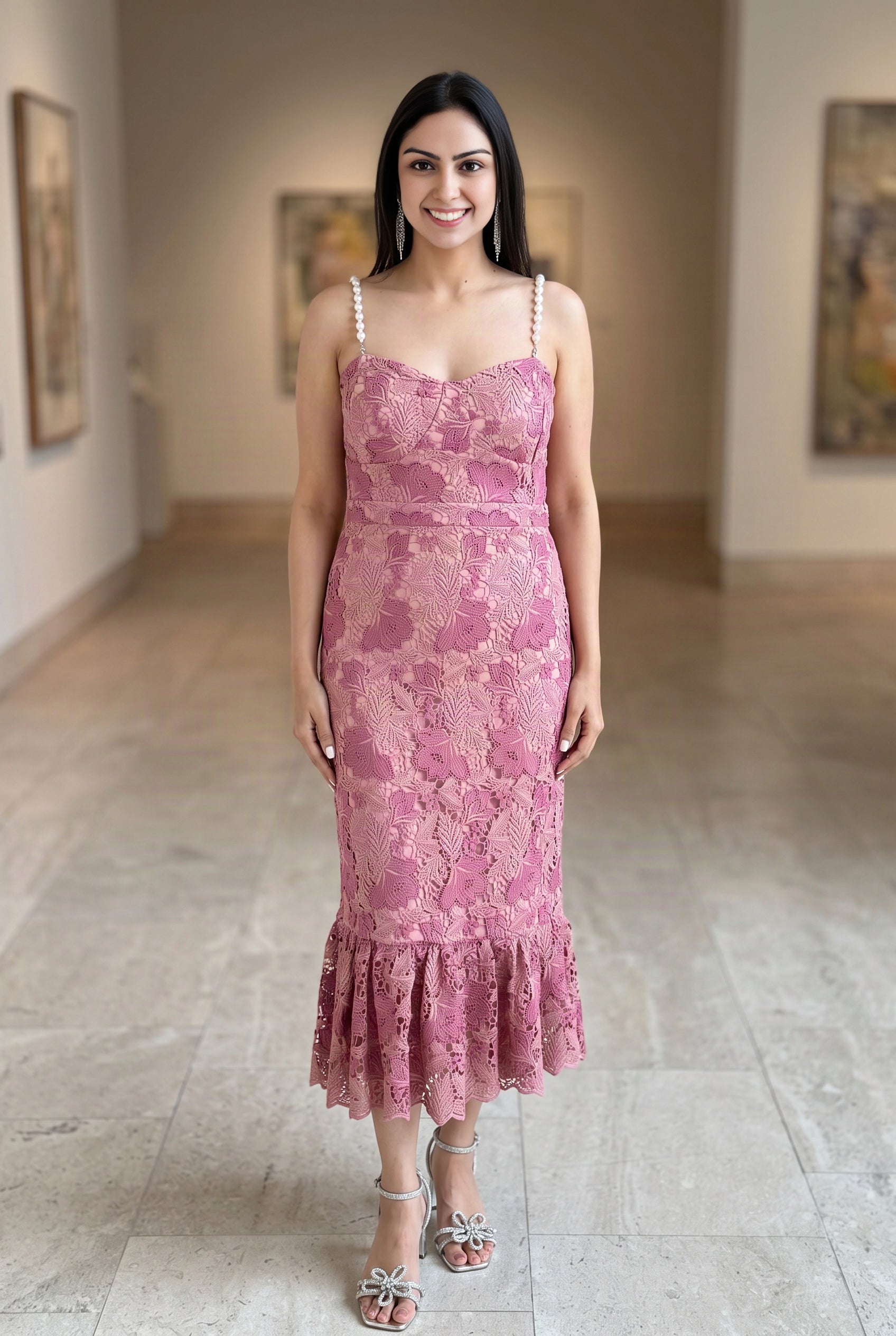Shweta wearing the Medium pink pearl-trim lace mermaid midi dress from the front.