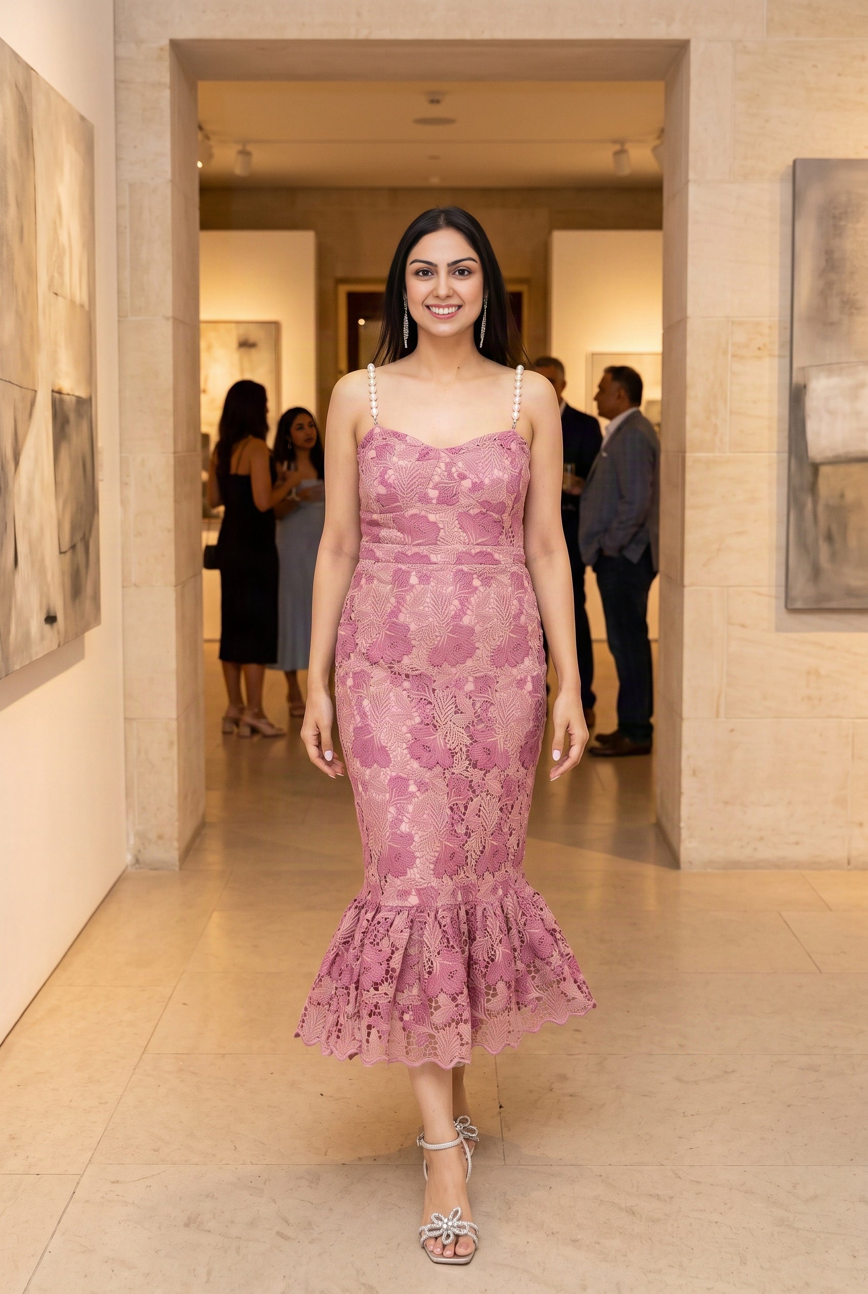 Shweta wearing the pink pearl-trim mermaid midi dress at a refined gallery event.