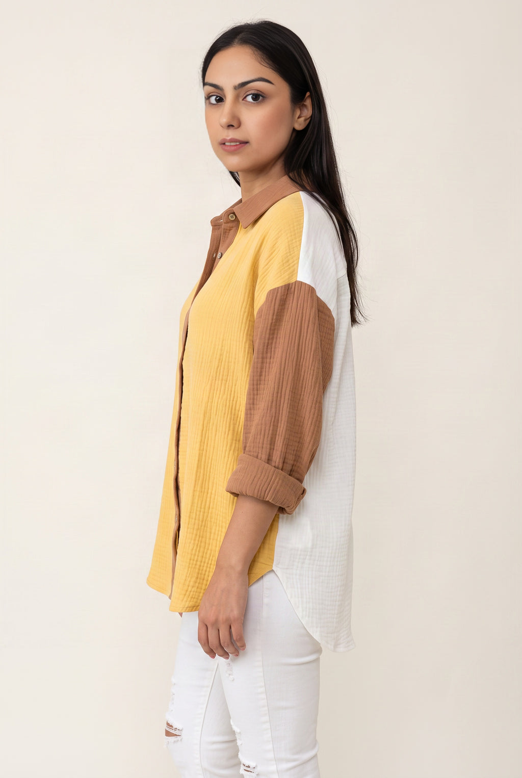 Side view of the Yellow Just Chilling shirt showing its oversized volume and shirttail length.
