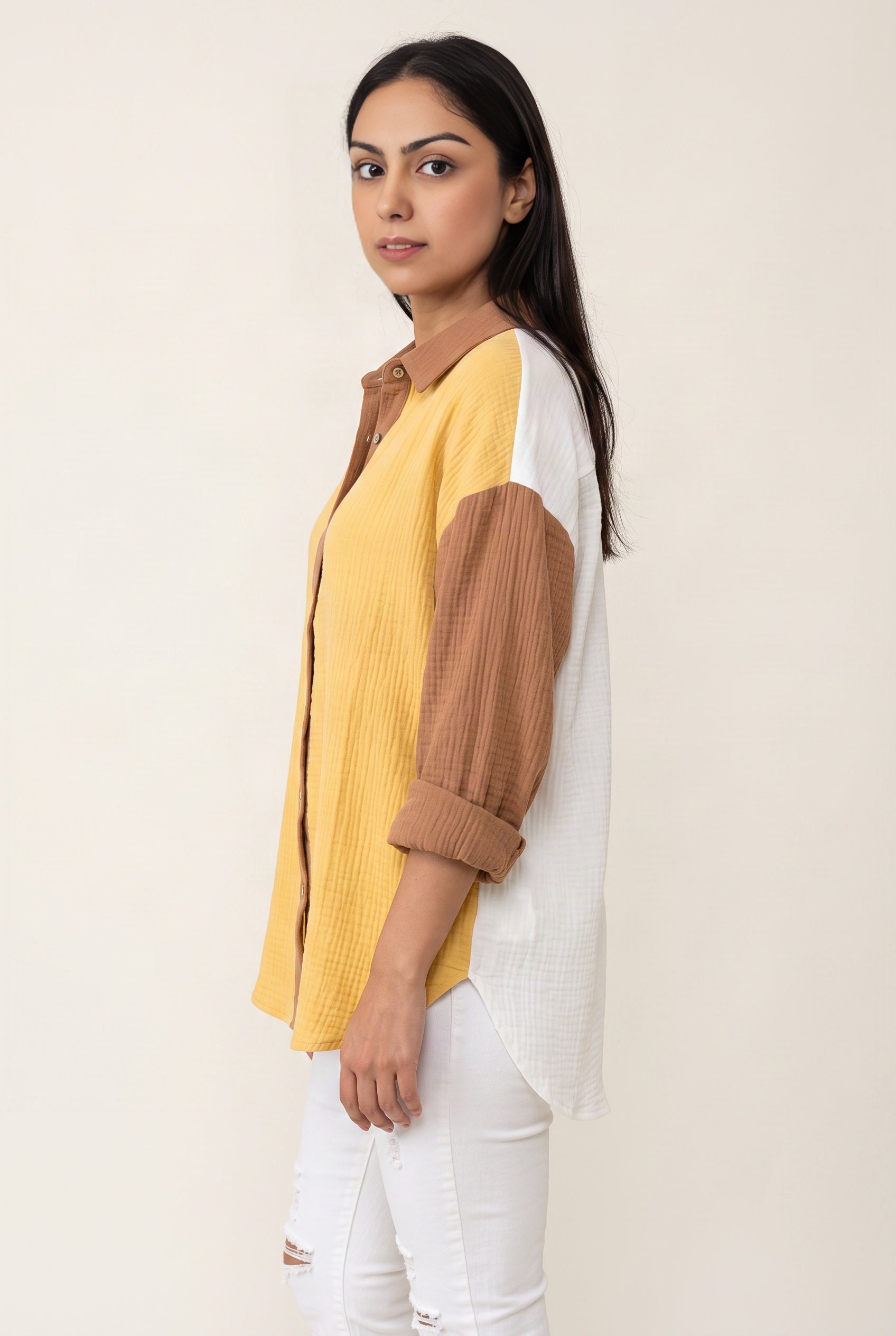 Side view of the Yellow Just Chilling shirt showing its oversized volume and shirttail length.