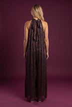 Back of the All That She Wants Jumpsuit showing the neck bow, long ties and open keyhole.