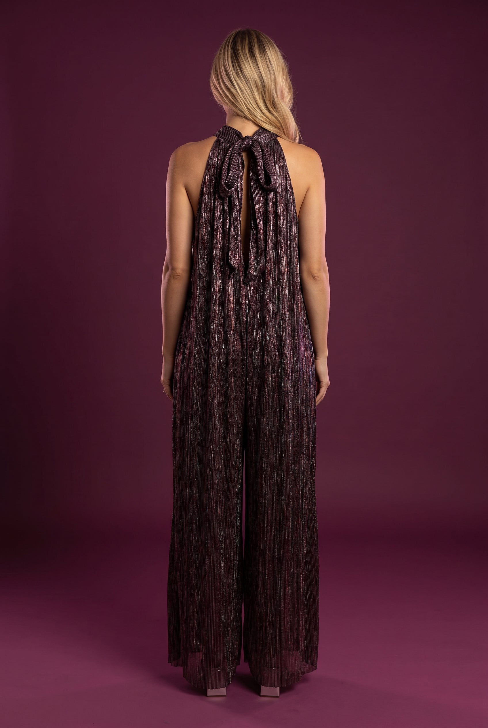 Back of the All That She Wants Jumpsuit showing the neck bow, long ties and open keyhole.