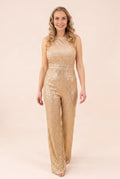 Front view of the My Chance To Dance gold sequin jumpsuit showing its fitted waist and wide legs.