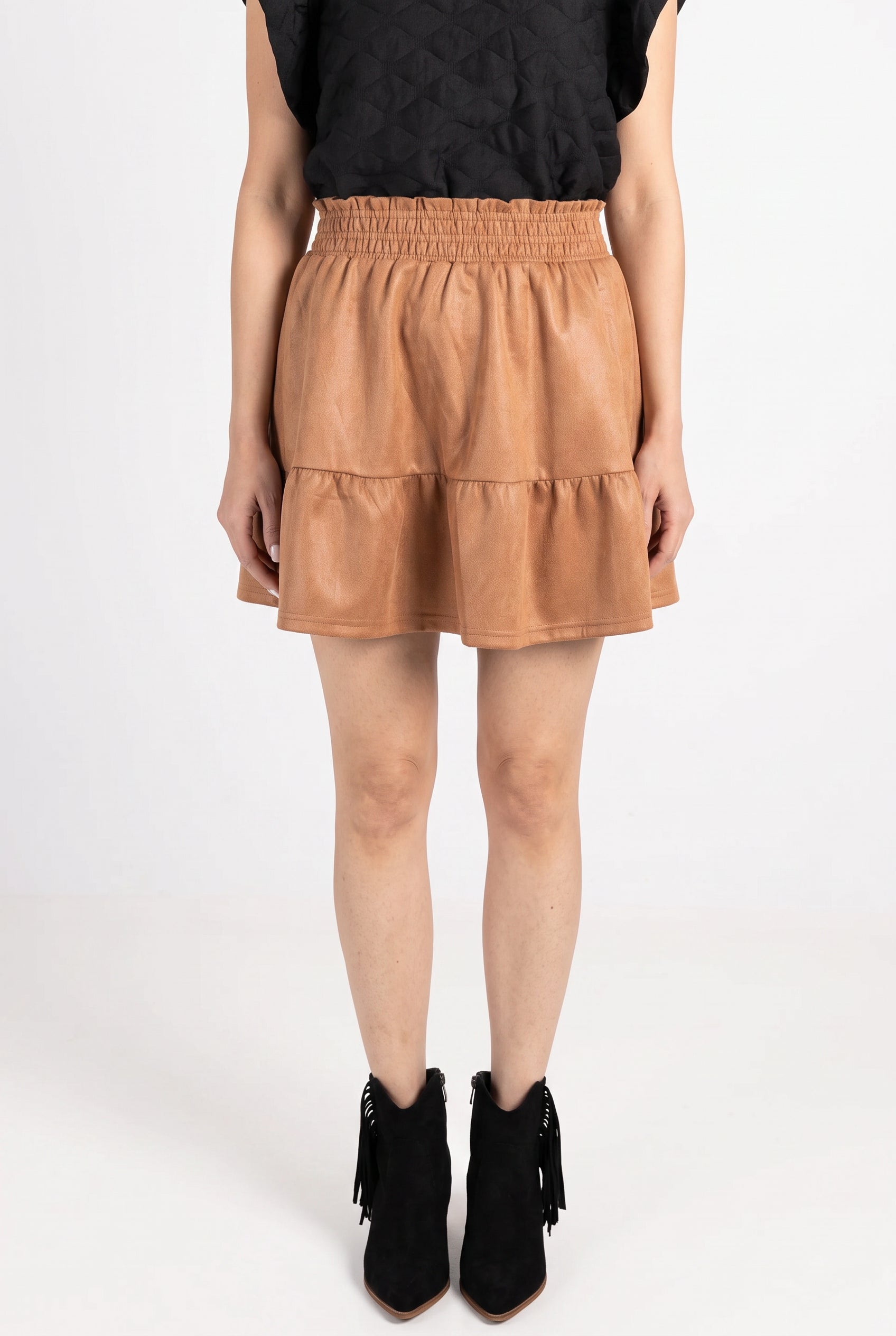 Front fit of the camel If We Never Met Mini Skirt showing its high waist, flounce and mini length.