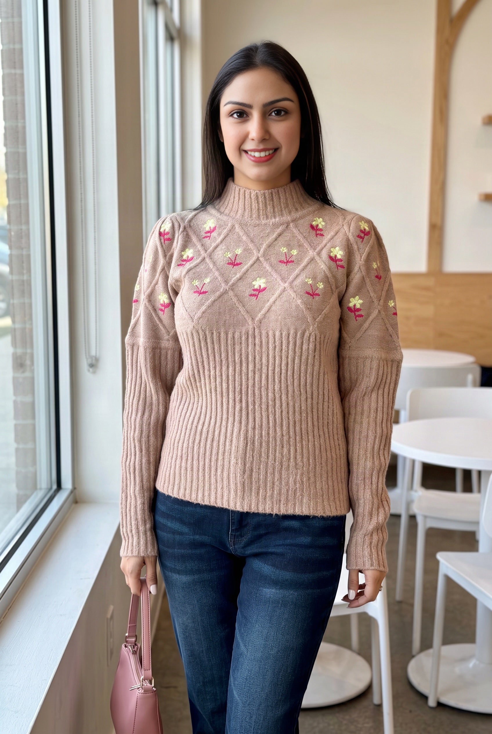 Happy Times Floral Sweater worn with dark jeans in a bright everyday café setting.