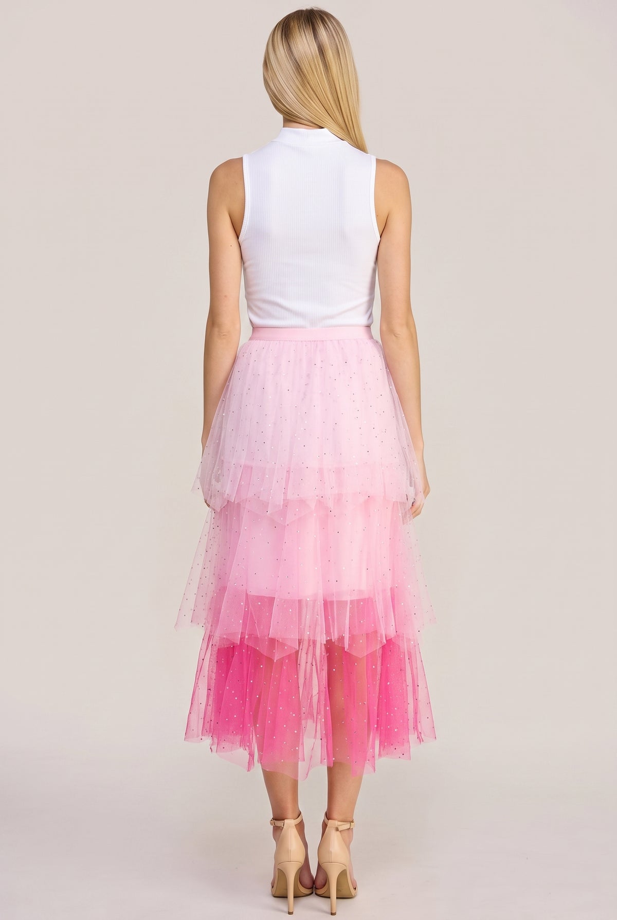 Back view of the Heart Over Mind pink tiered tulle midi skirt showing its waistband and rear tiers.