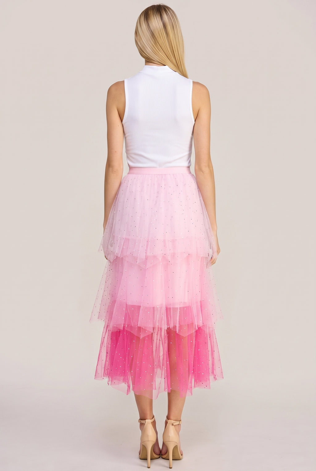 Back view of the Heart Over Mind pink tiered tulle midi skirt showing its waistband and rear tiers.
