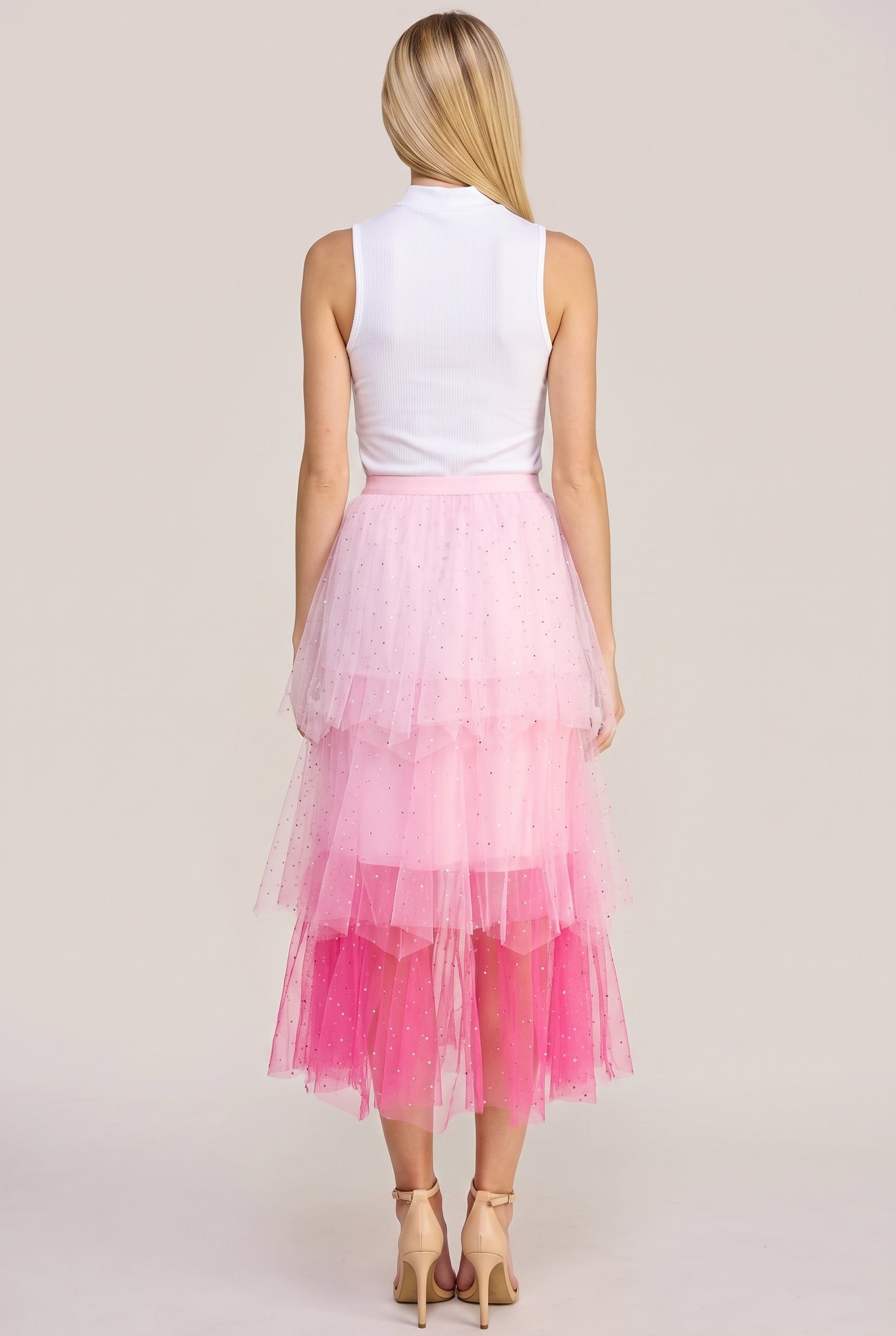 Back view of the Heart Over Mind pink tiered tulle midi skirt showing its waistband and rear tiers.