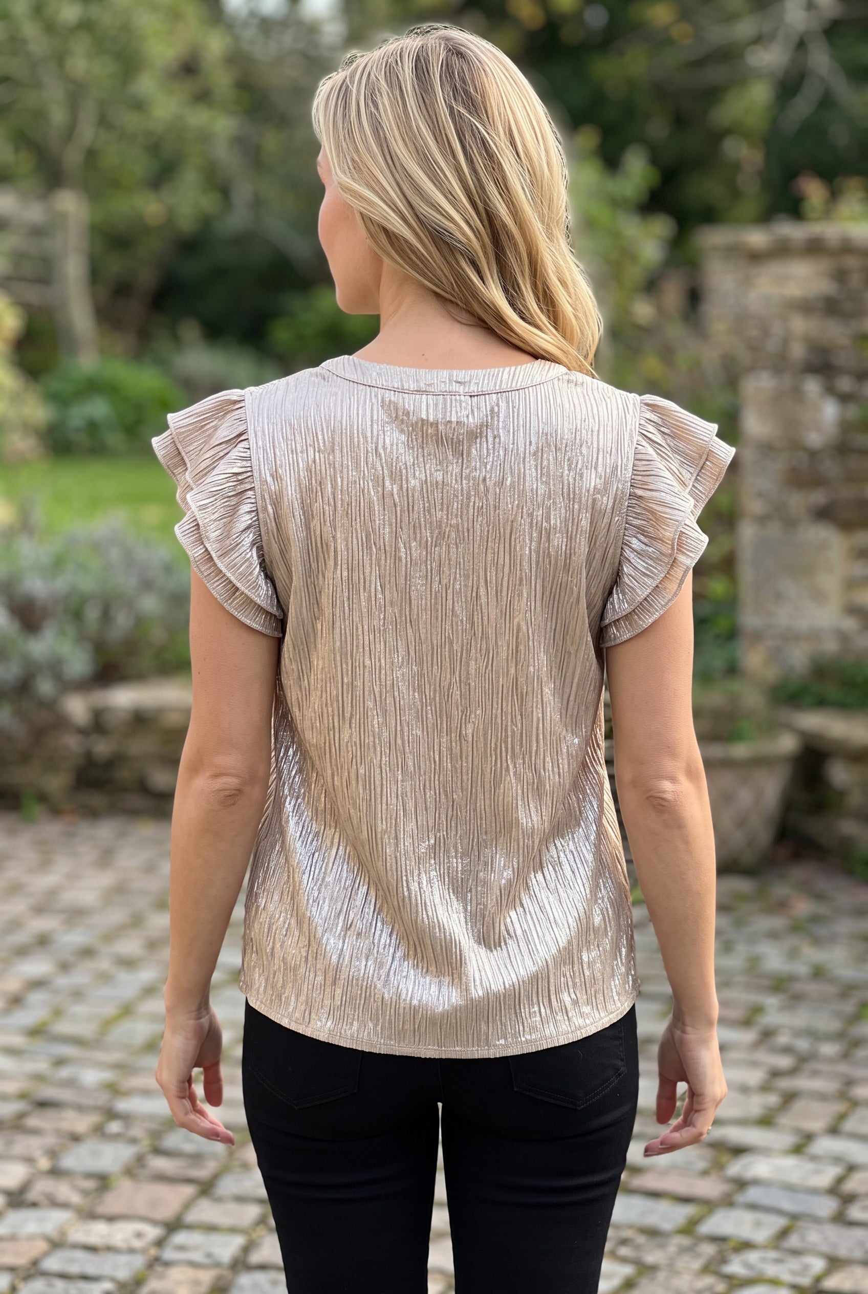 Full back of the Champagne What Just Happened Ruffle Sleeve Top, including neckline, sleeves and hem.