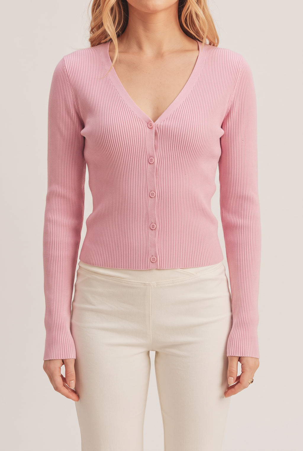 Front fit of the pink I Don't Care Cardigan Sweater in Medium on Elsa.