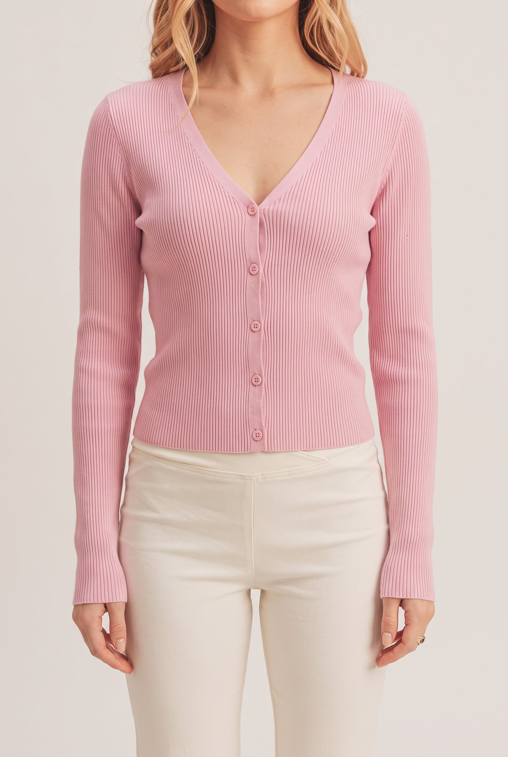 Front fit of the pink I Don't Care Cardigan Sweater in Medium on Elsa.
