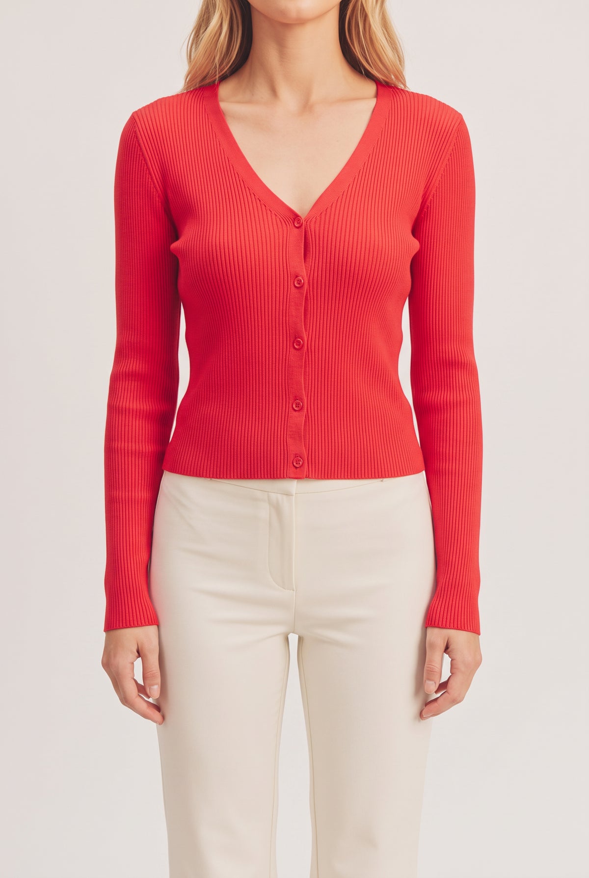Front fit of the red I Don't Care Cardigan Sweater in Medium on Elsa.
