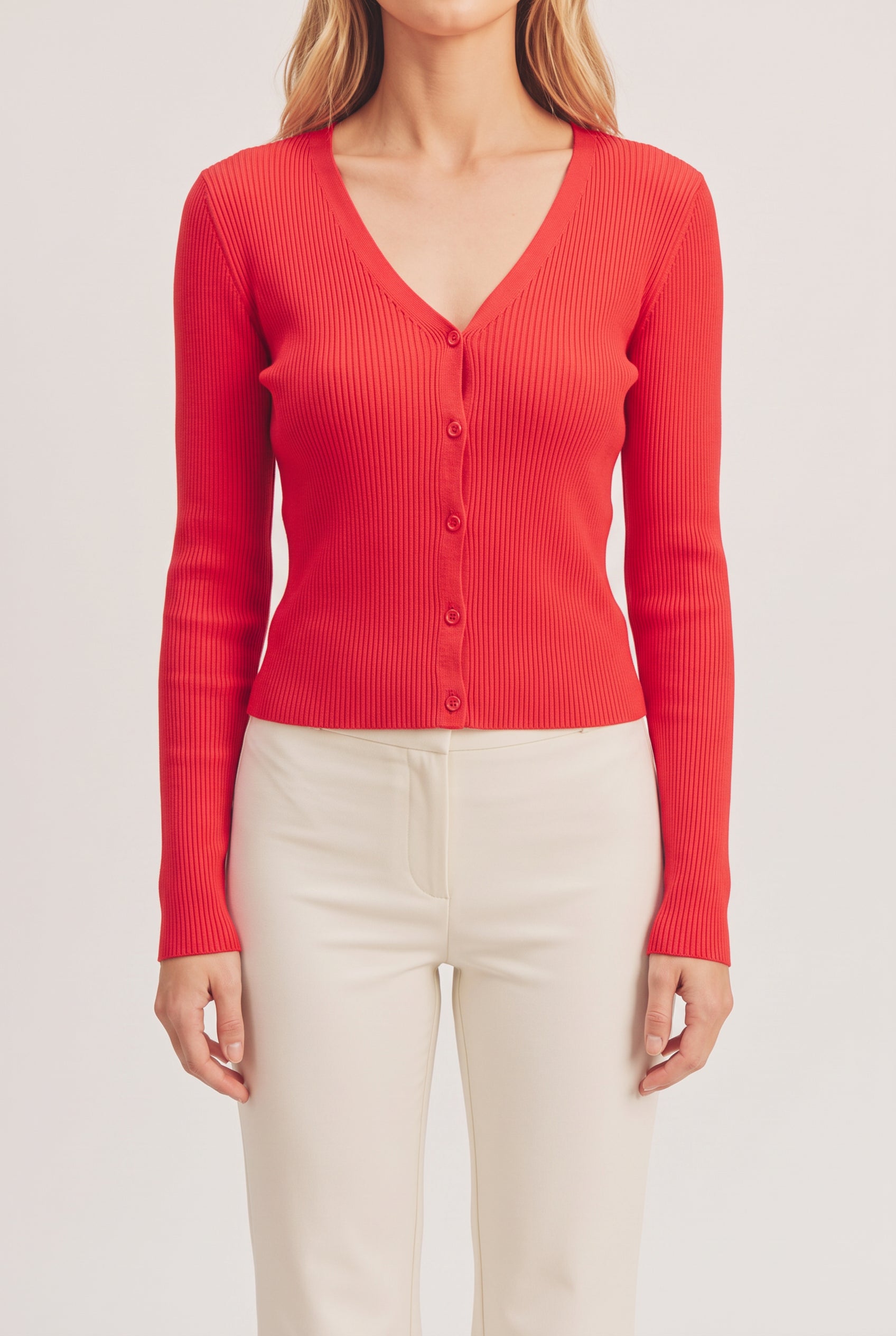Front fit of the red I Don't Care Cardigan Sweater in Medium on Elsa.