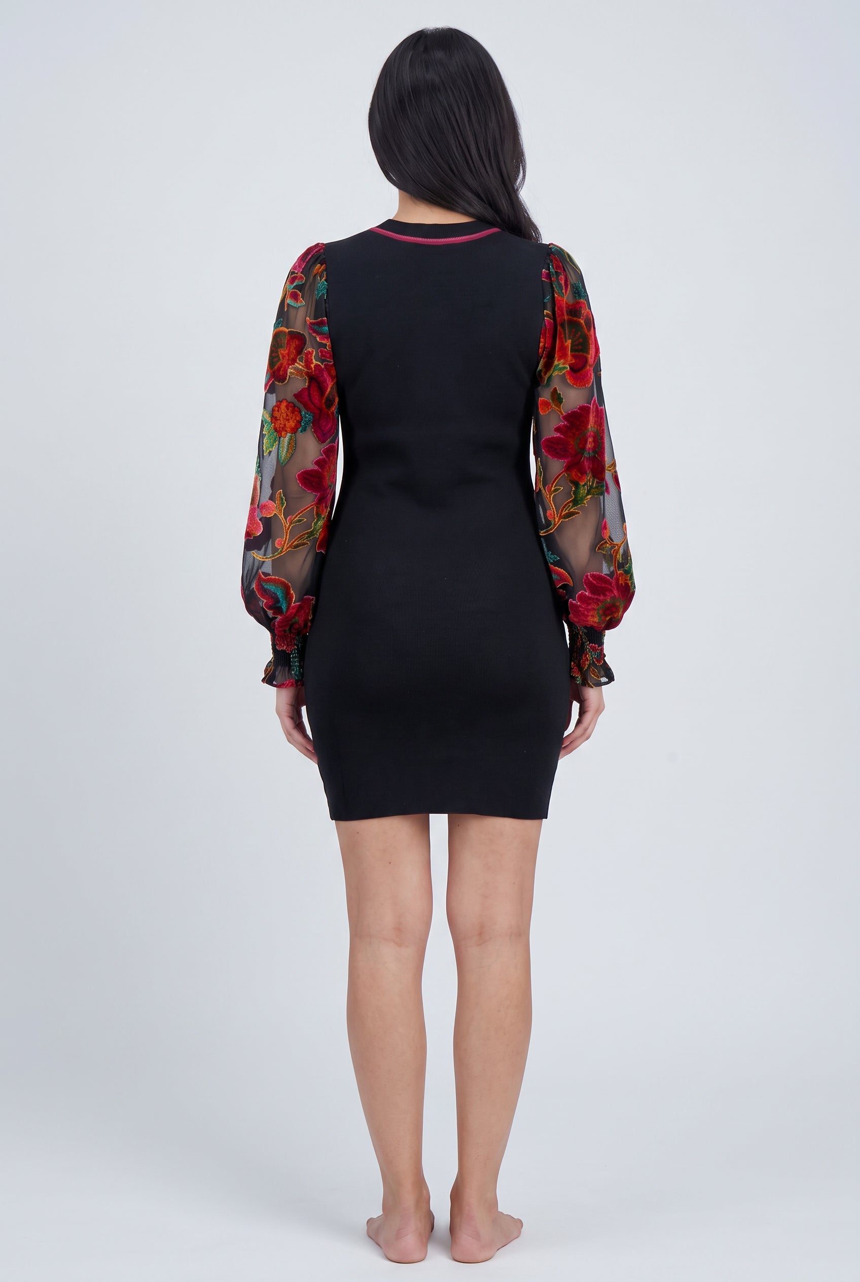 Back fit of You're My Favorite Sweater Dress showing the plain knit body and floral sleeves.