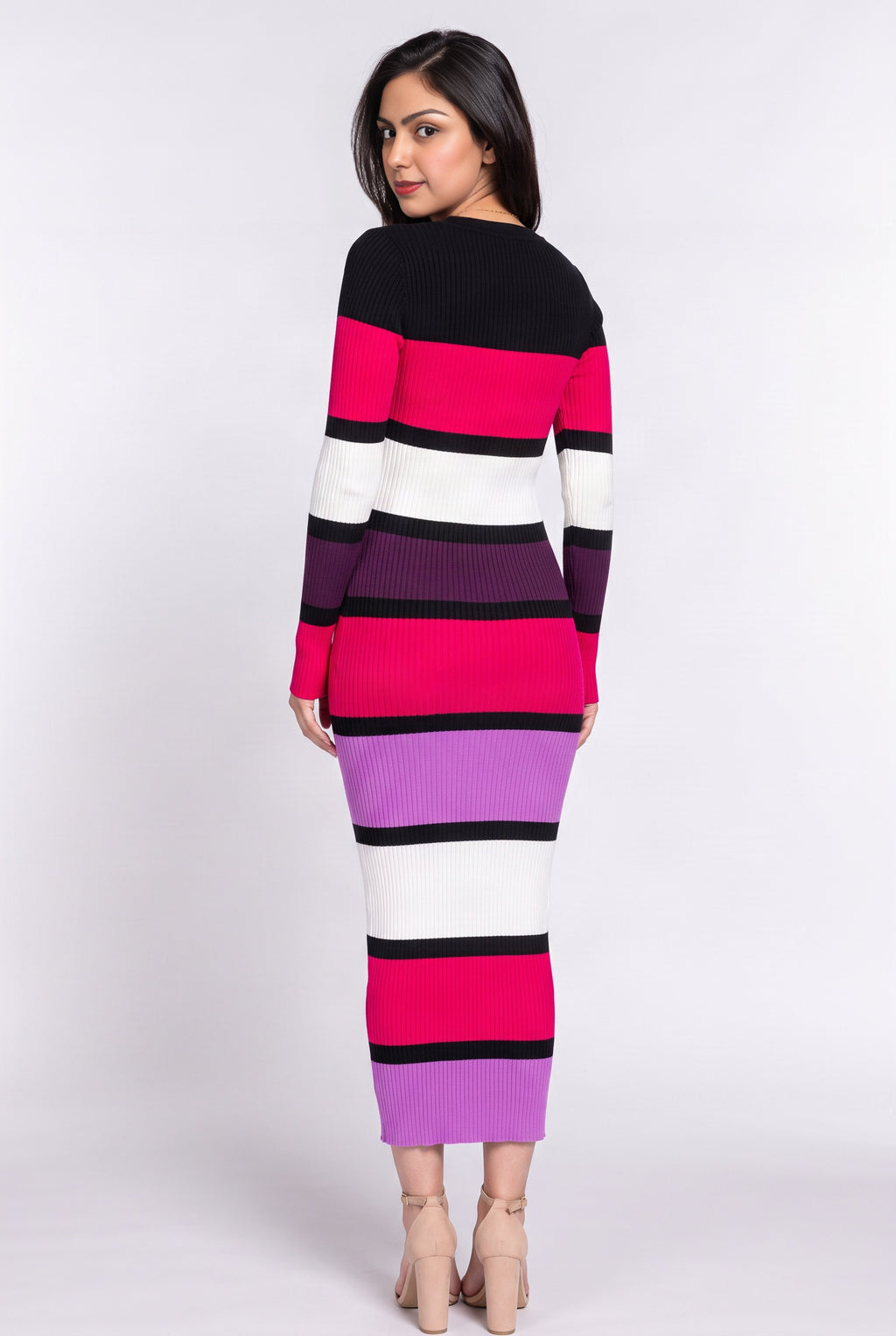 Back view of the multicolor sweater dress showing its uninterrupted fitted column and stripe placement.