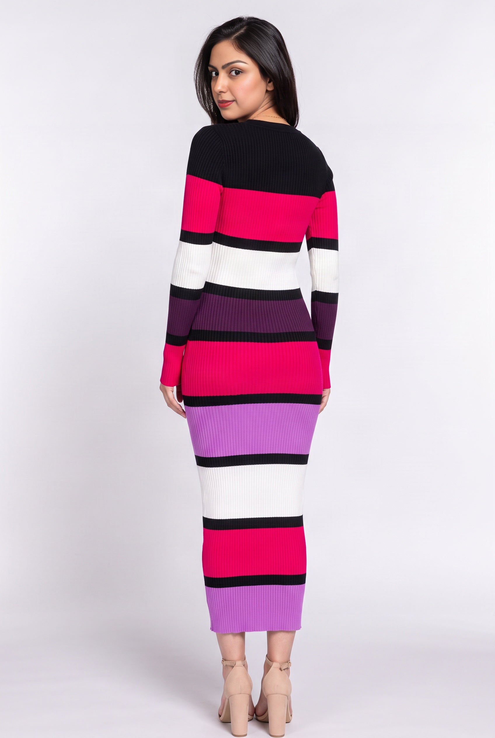Back view of the multicolor sweater dress showing its uninterrupted fitted column and stripe placement.