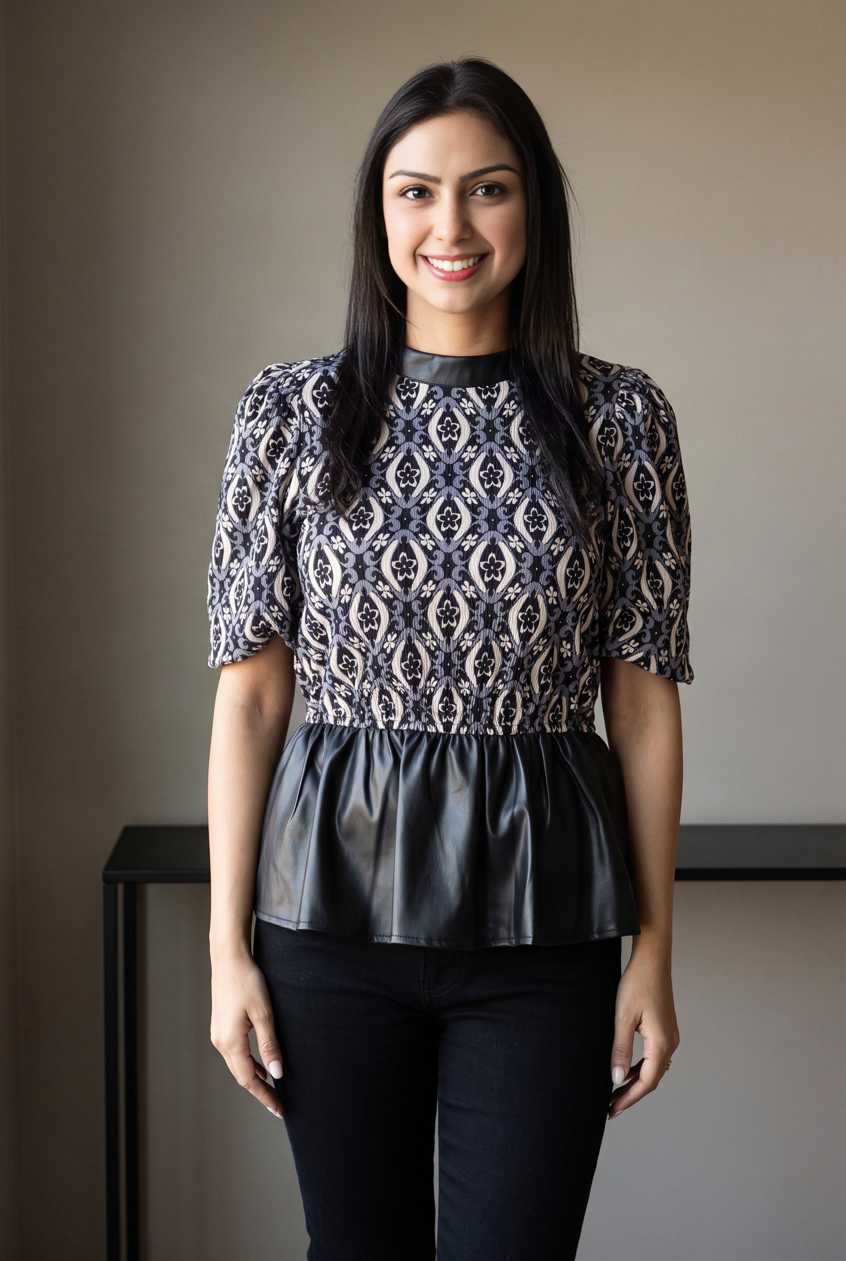 Shweta styles the Last Night peplum top with dark denim for a polished casual look.