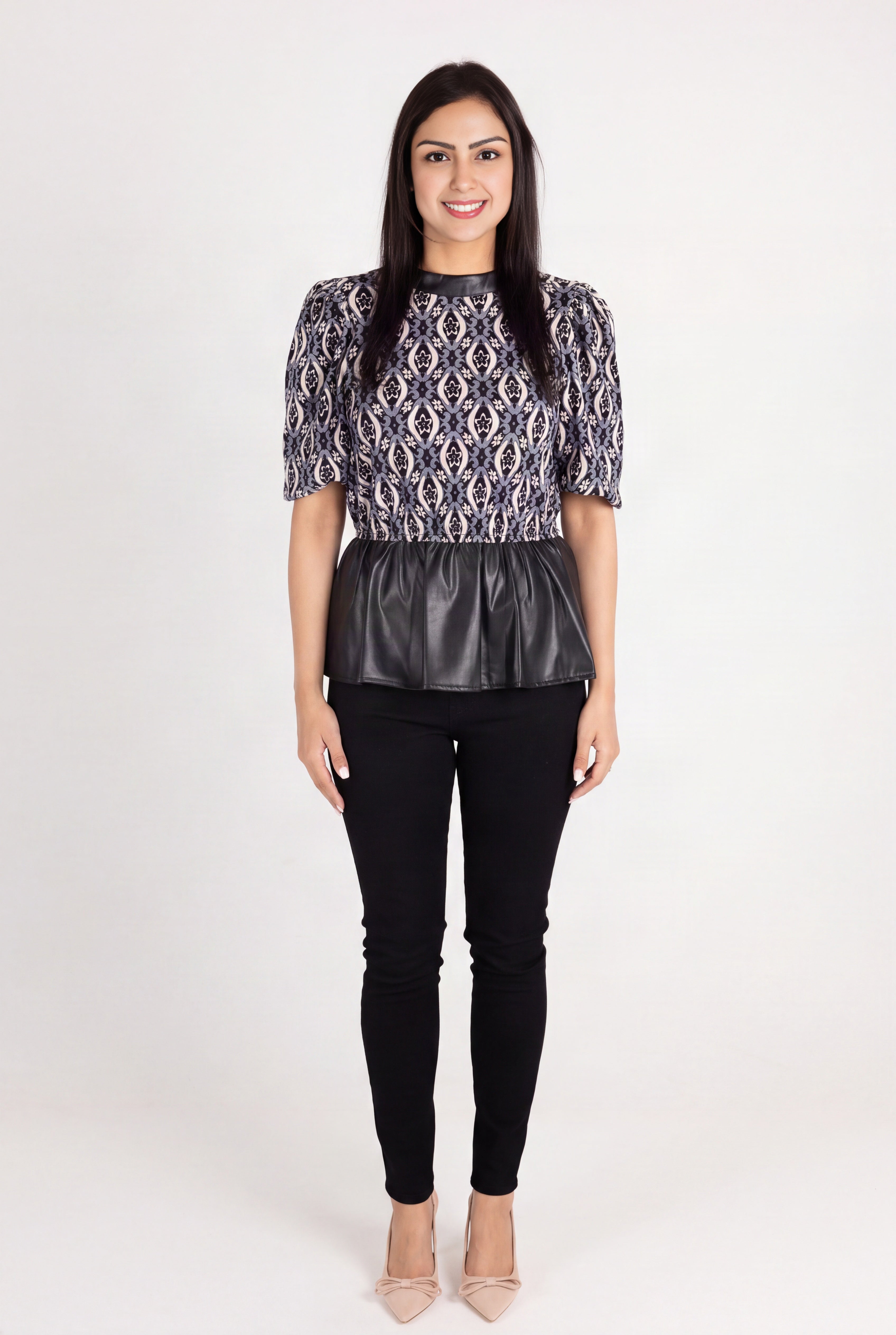 Last Night peplum top showing the geometric bodice, waist seam and glossy faux-leather folds.