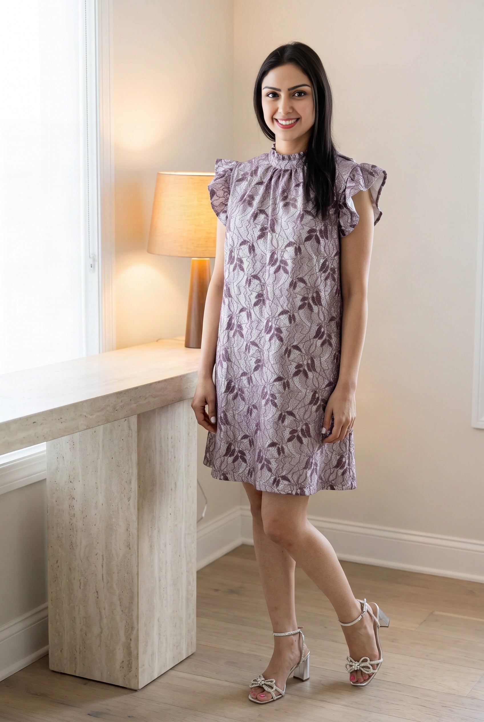 Shweta wearing the Lavender shift dress in a polished day-to-dinner interior.