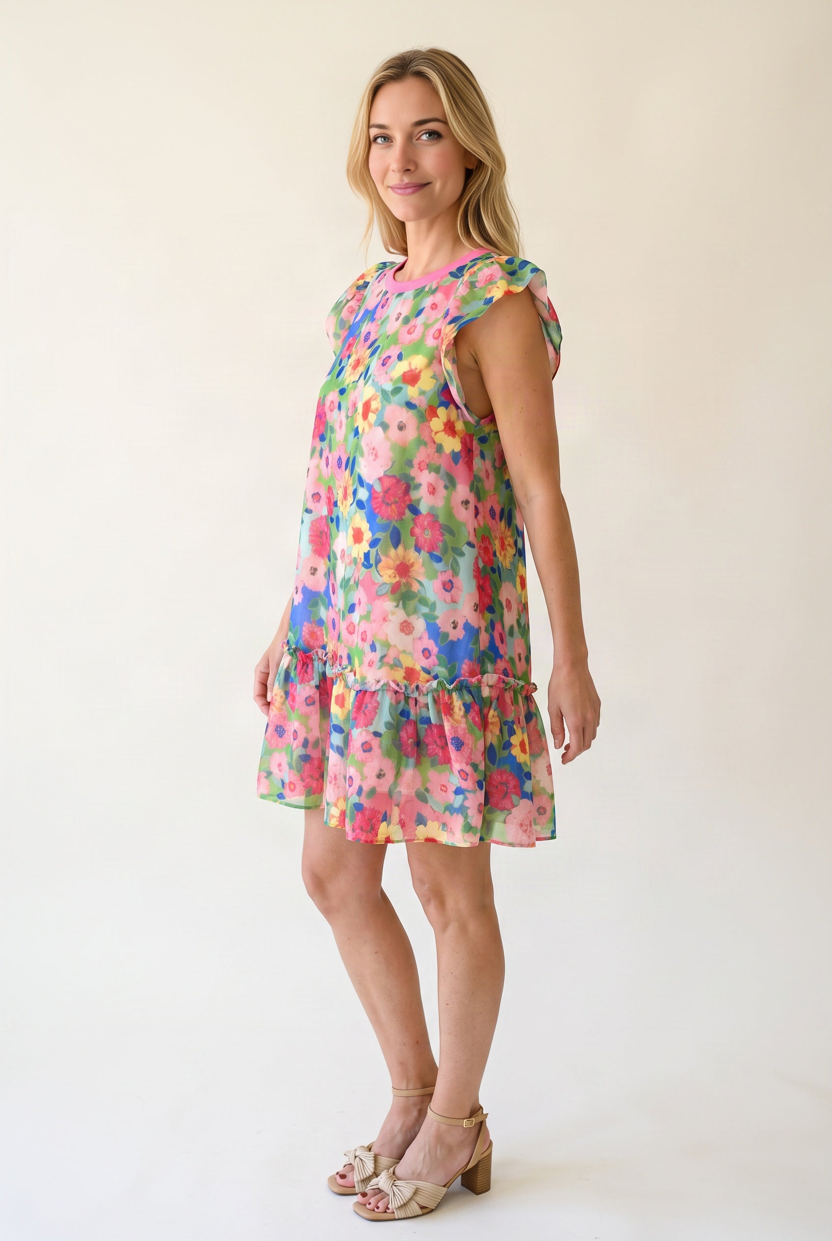 Angled side fit of the Keep Blooming floral mini dress showing armhole coverage and relaxed body volume.