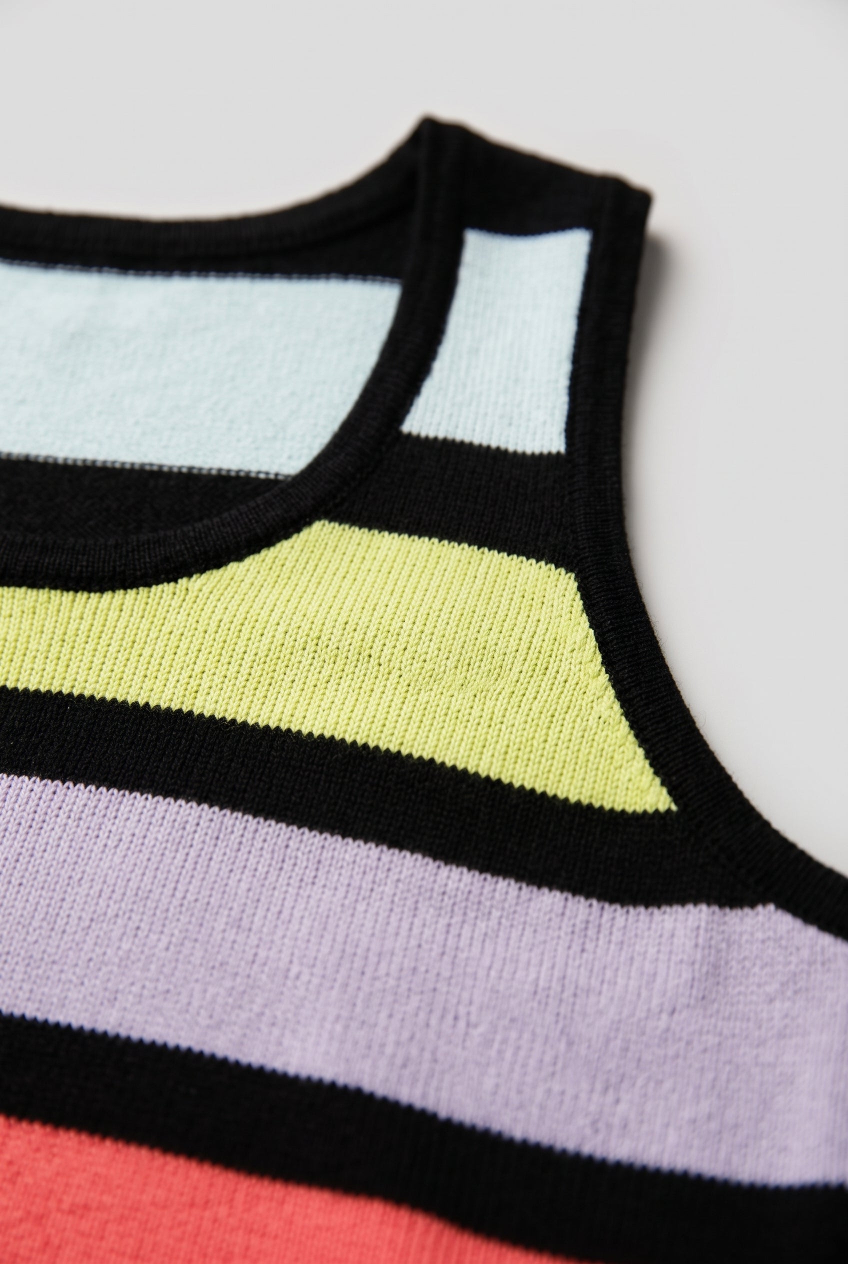Knit texture and multicolor stripe detail on the Calm Down Striped Tank Top.