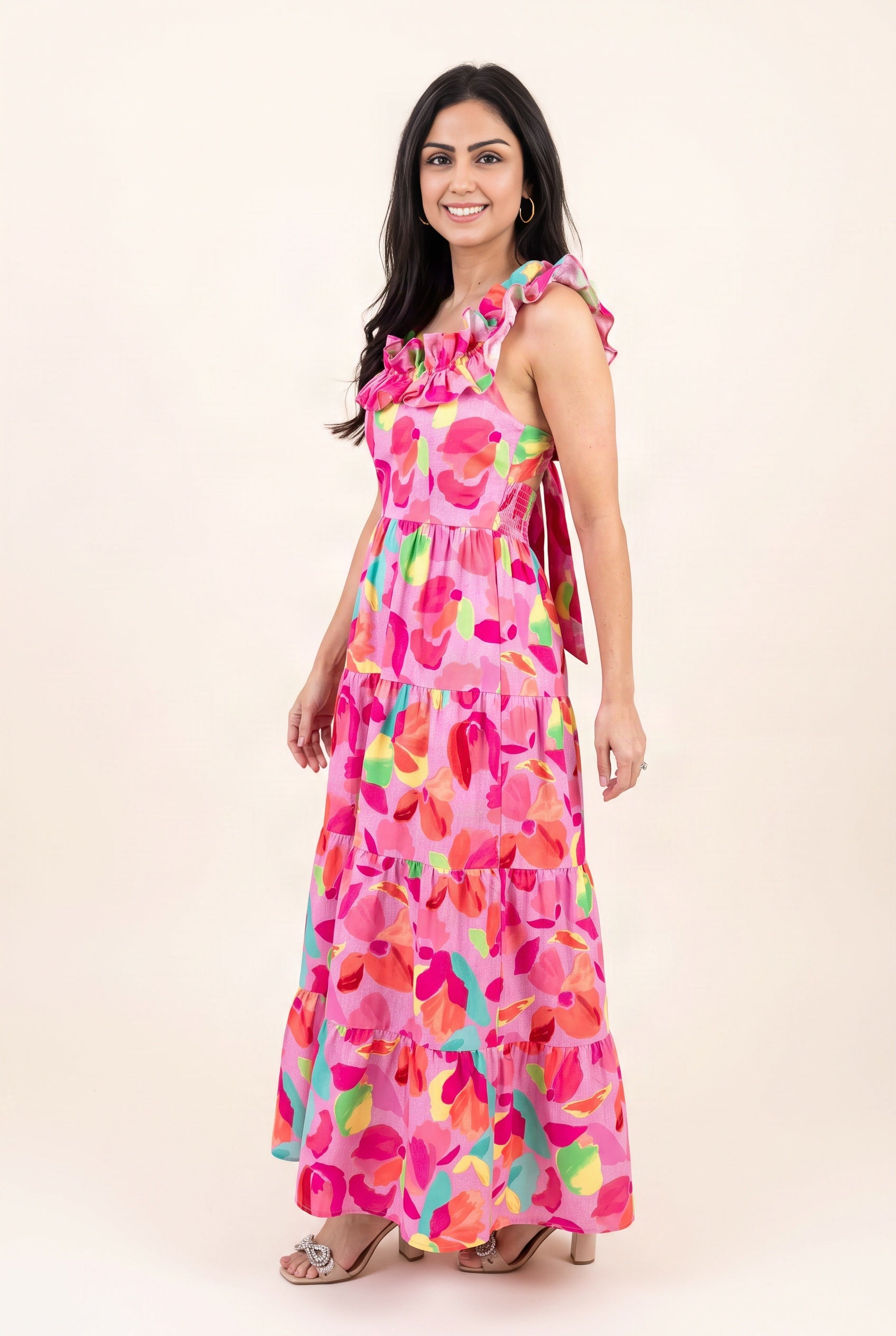 Angled side view of the floral maxi dress showing armhole coverage, fitted bodice and waist placement.