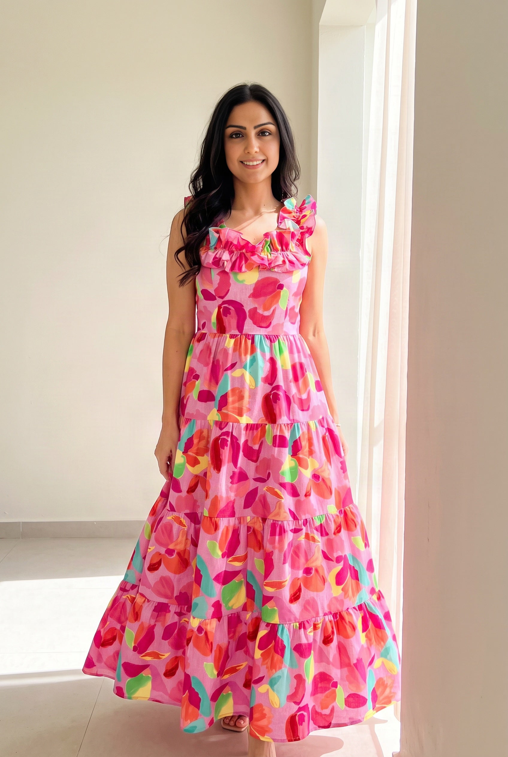 Blooming Affair floral maxi dress in sunlight showing the lightweight fabric over the wearer’s legs.