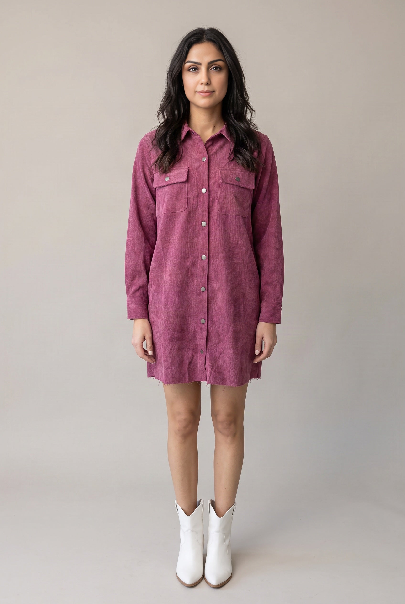 Shweta wearing the Small mauve corduroy shirt dress from the front, showing its relaxed mini fit.
