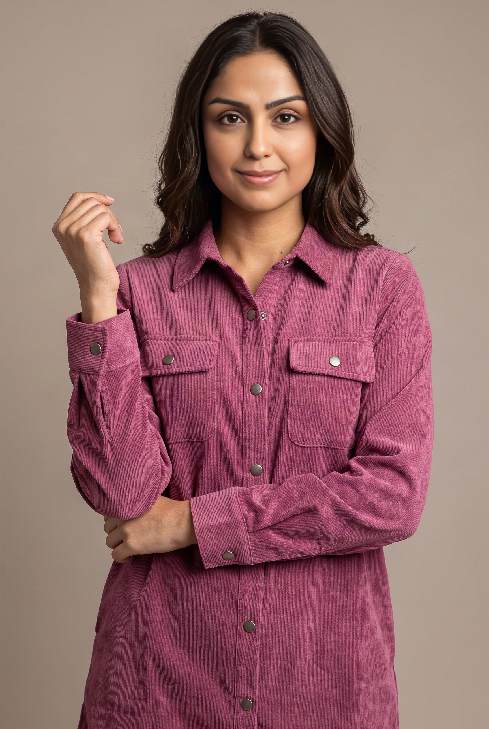 Close view of the mauve corduroy shirt dress showing fine ribs, cuff snaps, and pocket construction.