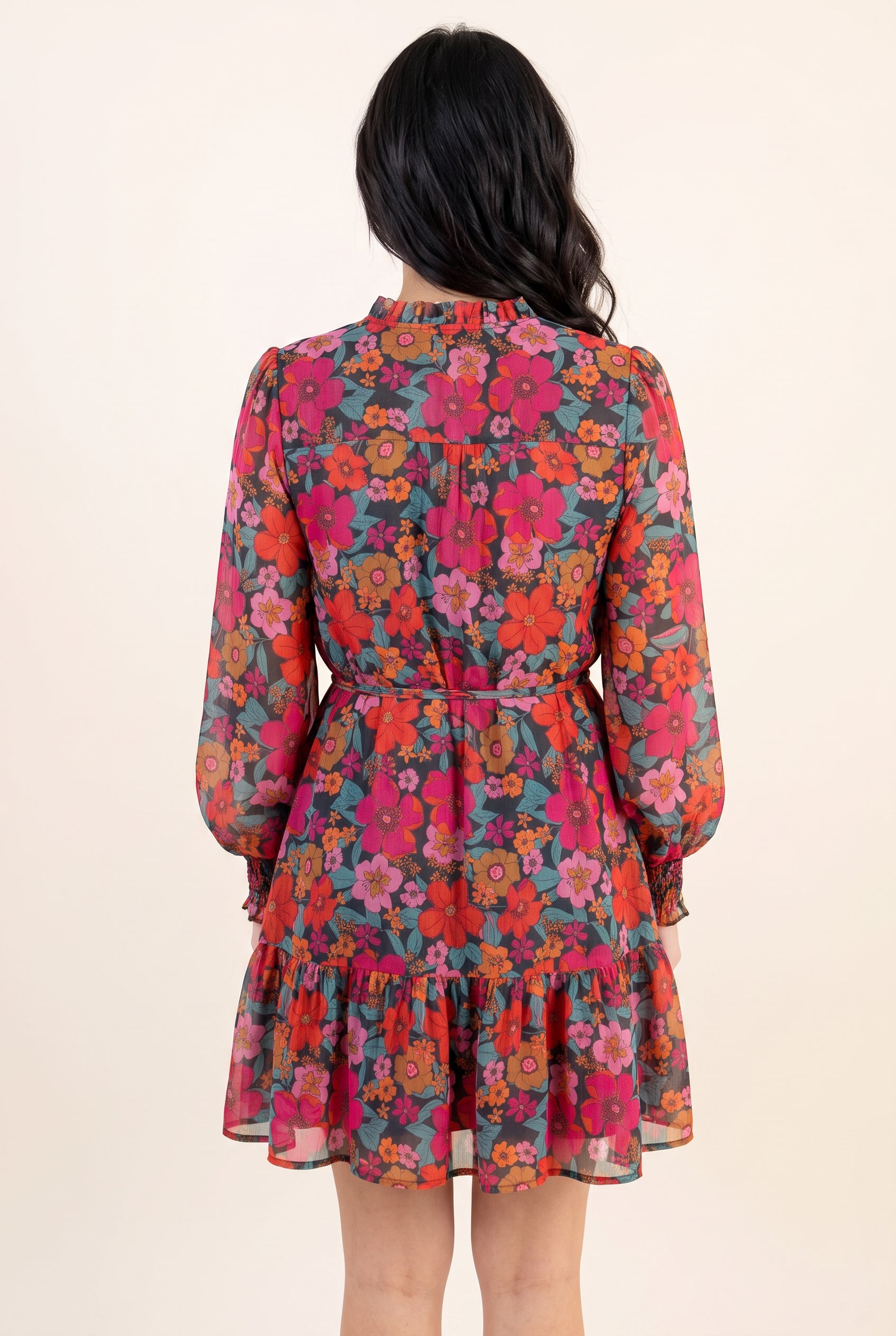 Back view of the Only If You Knew Floral Dress in Small showing the yoke, waist tie and tiered hem