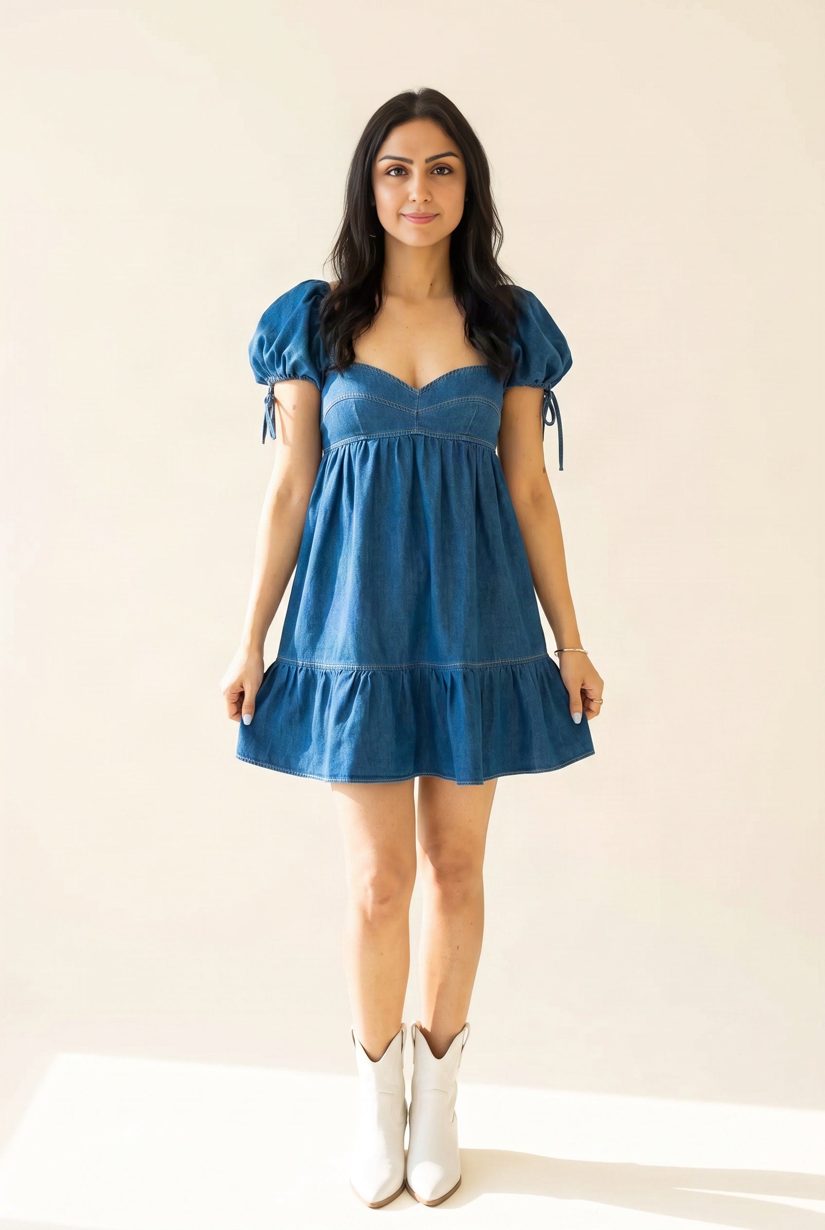 Ready To Zoom denim babydoll dress front view showing its sweetheart bodice and mini A-line shape.