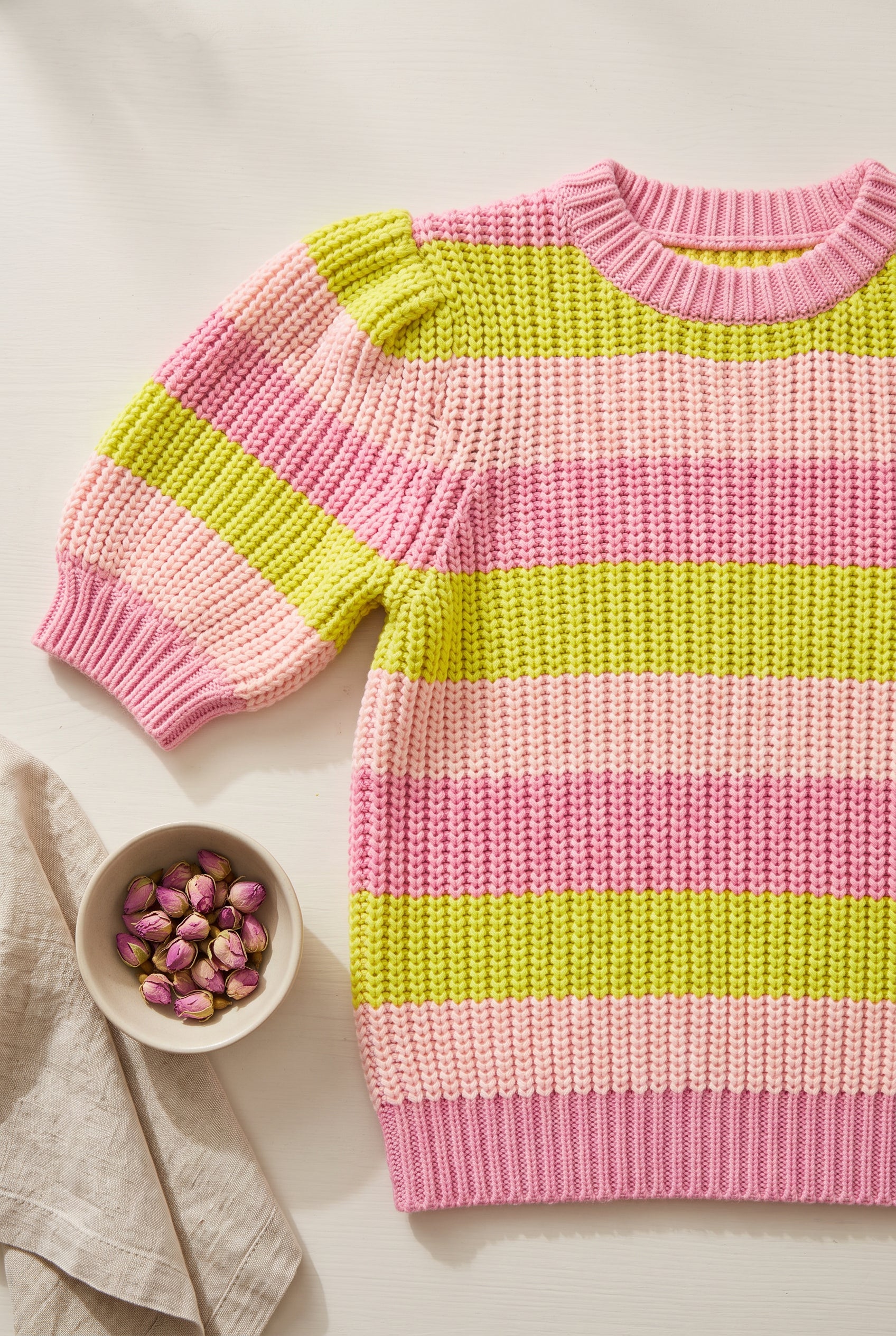 Close detail of the Share Your Story Sweater Top showing its chunky knit, ribbing, and stripe colors.