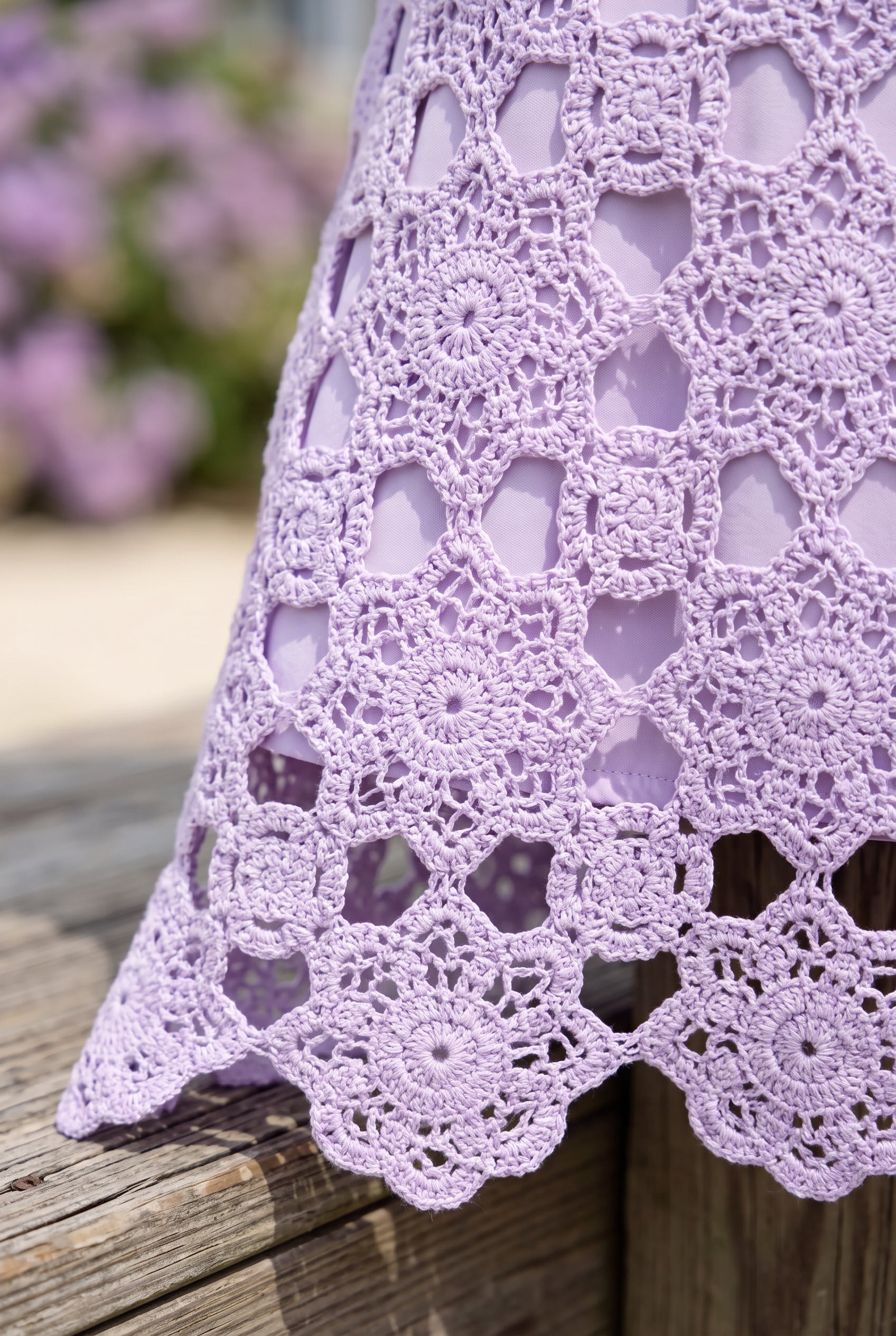 Close detail of the lavender floral crochet, tonal lining edge and openwork scalloped hem.