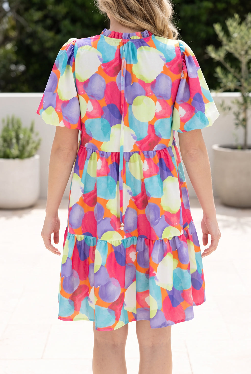 Back fit of the Crush On You Babydoll Dress in Small, showing the gathered neckline and tiered hem.