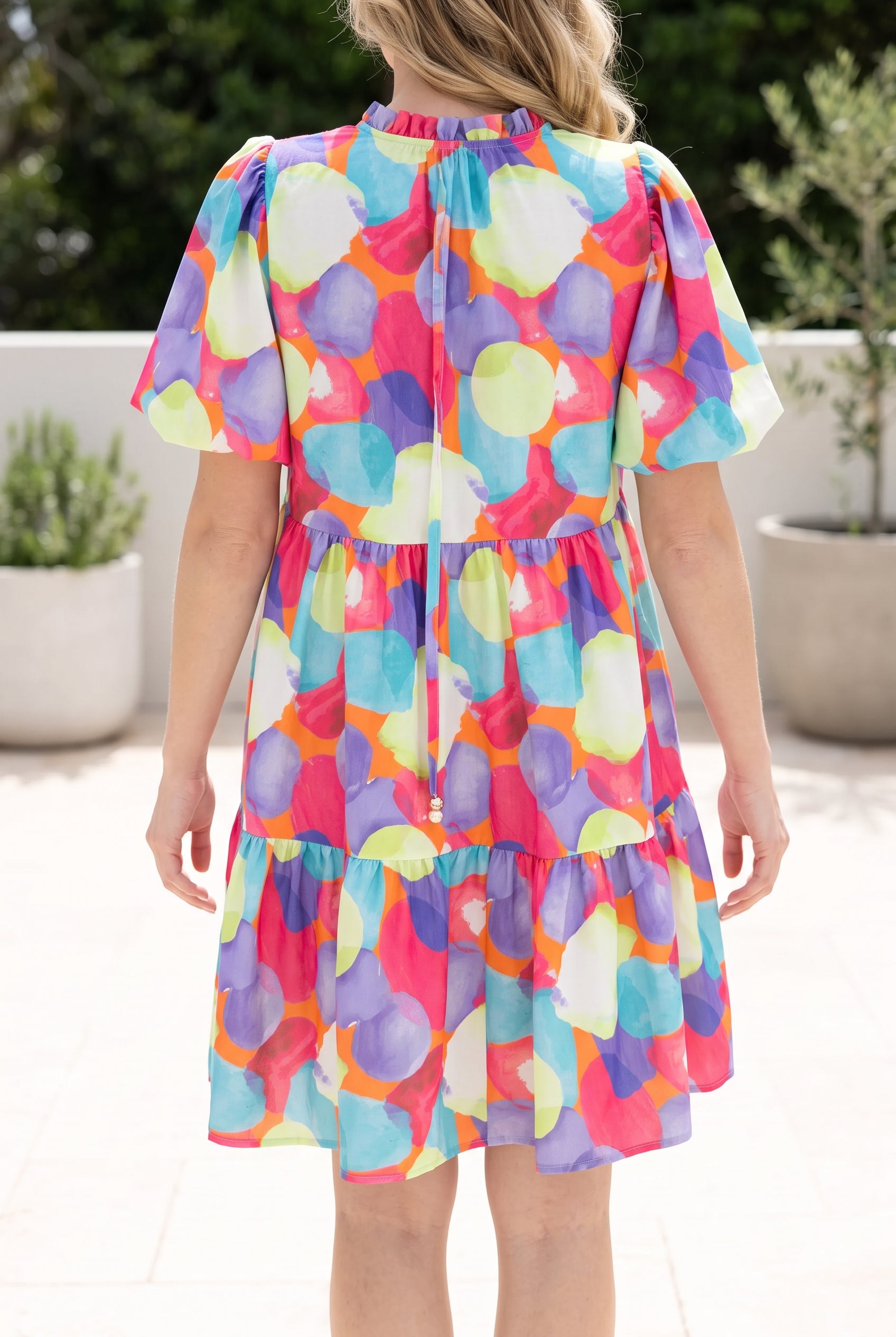 Back fit of the Crush On You Babydoll Dress in Small, showing the gathered neckline and tiered hem.