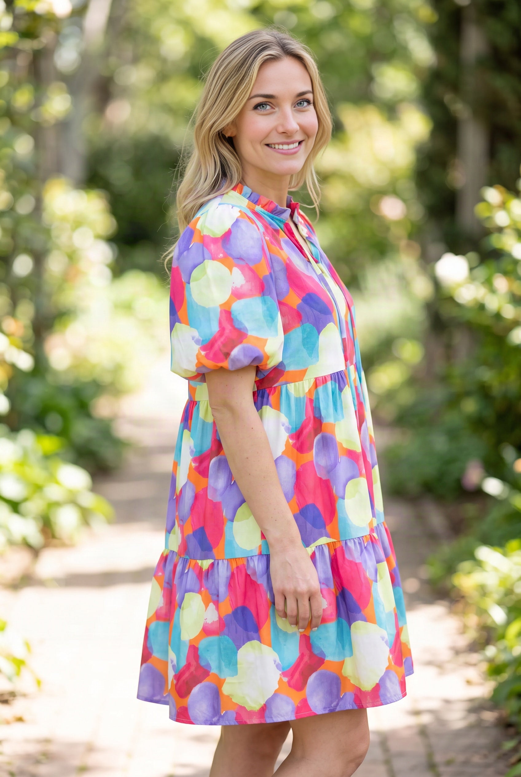 Angled side fit of the Crush On You Babydoll Dress in Small, showing its puff sleeve and loose shape.