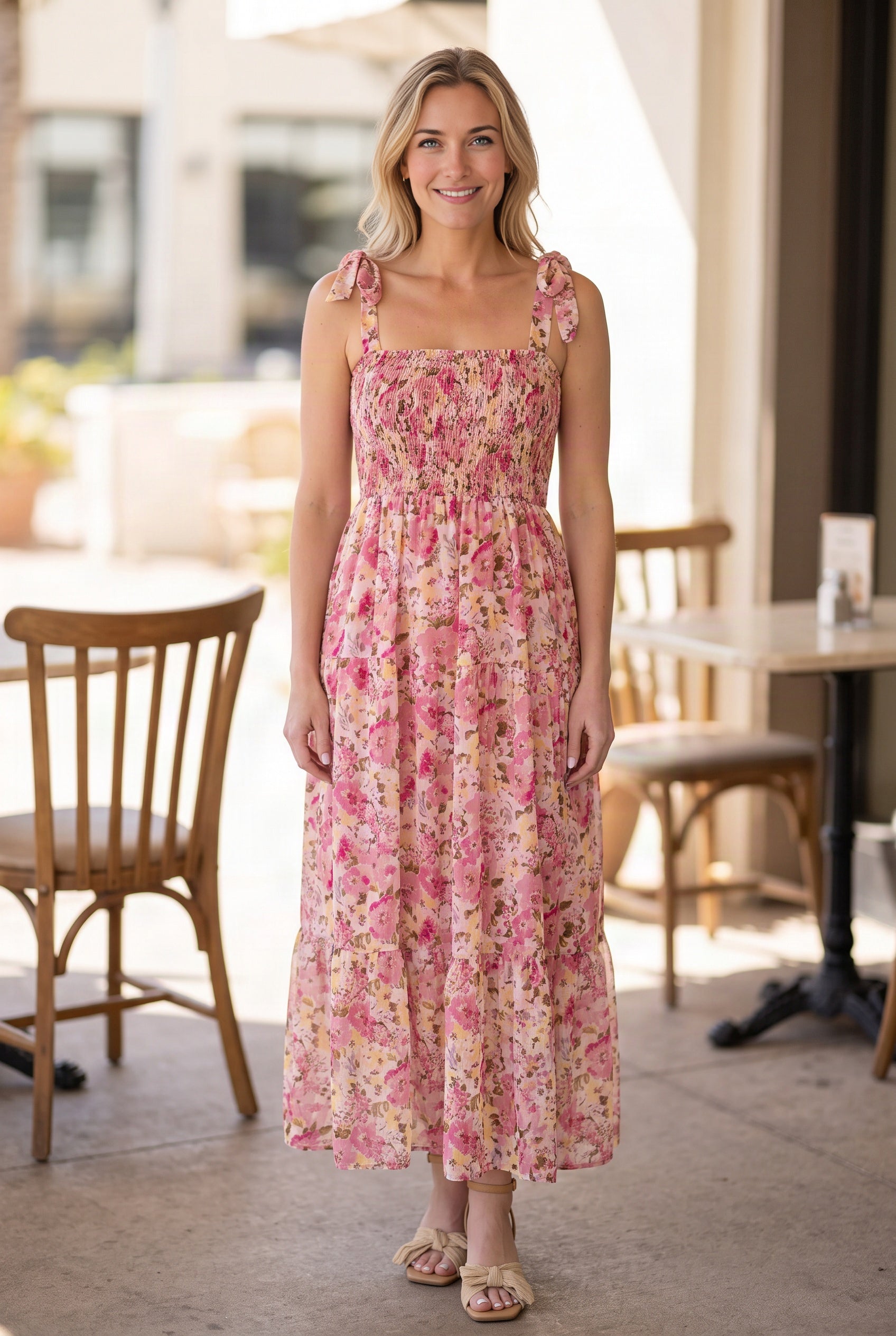 Enchanted Moments Floral Smocked Maxi Dress in Small shown full length on a sunny patio.