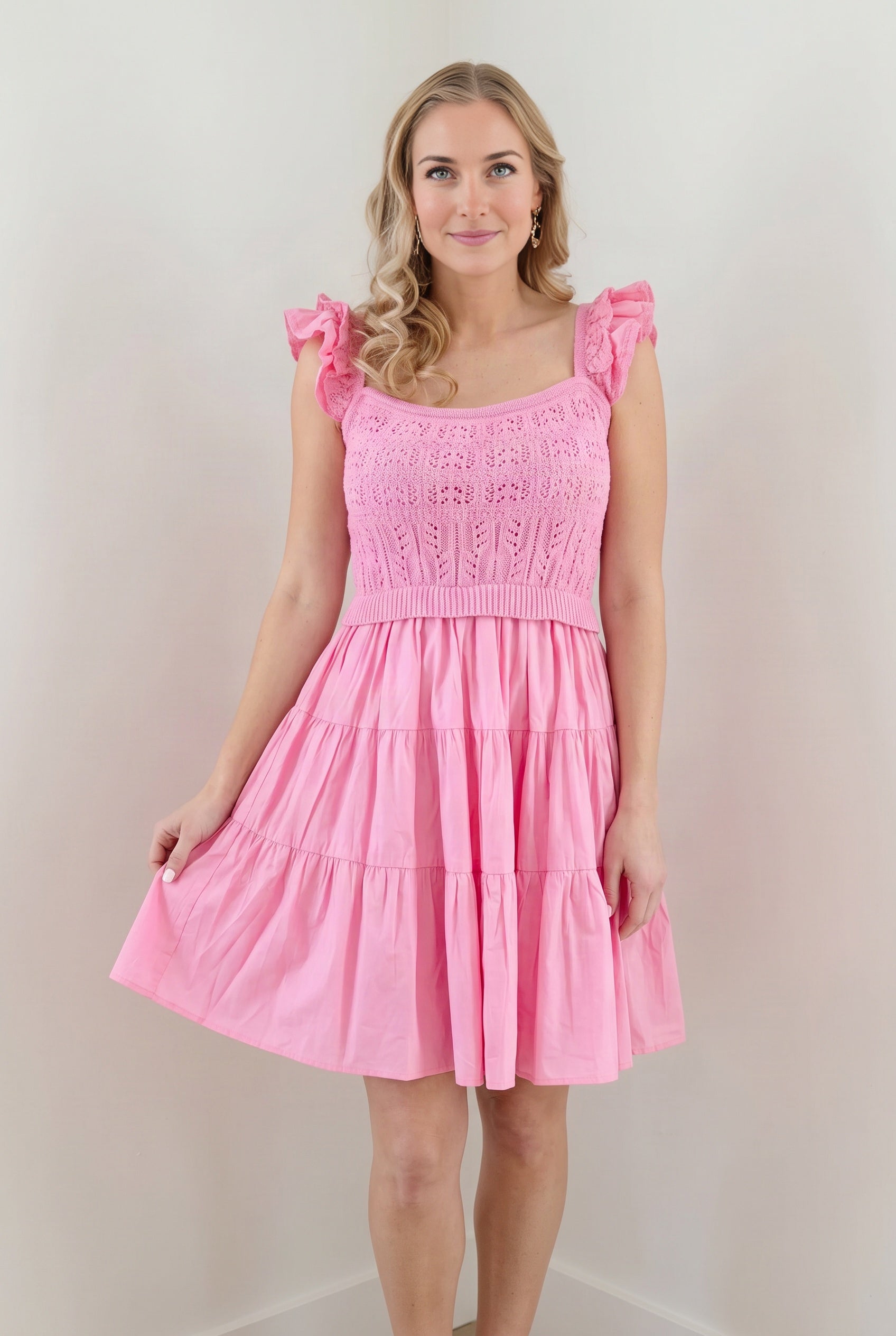 Elsa wearing the pink crochet A-line dress for a feminine daytime occasion.