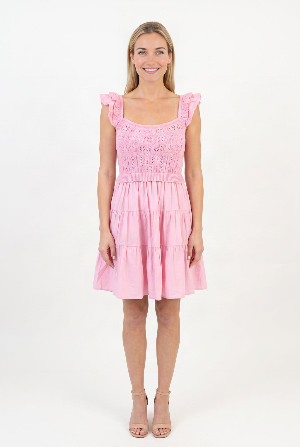 Front fit of the Completely In Tune pink crochet dress in Small, showing its square neck and tiered skirt.